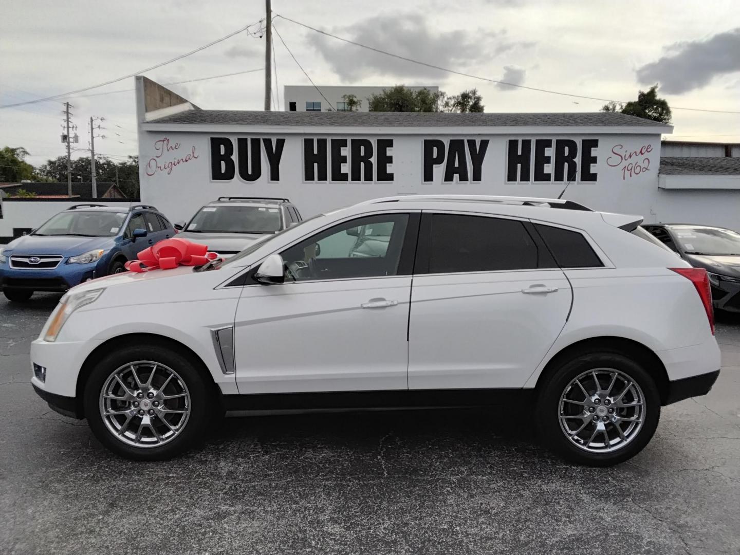 2014 White /Beige Cadillac SRX Performance Collection FWD (3GYFNCE31ES) with an 3.6L V6 DOHC 24V FFV engine, 6-Speed Automatic transmission, located at 6112 N Florida Avenue, Tampa, FL, 33604, (888) 521-5131, 27.954929, -82.459534 - $499 DOWN PLUS TAX & TAG. - Photo#0