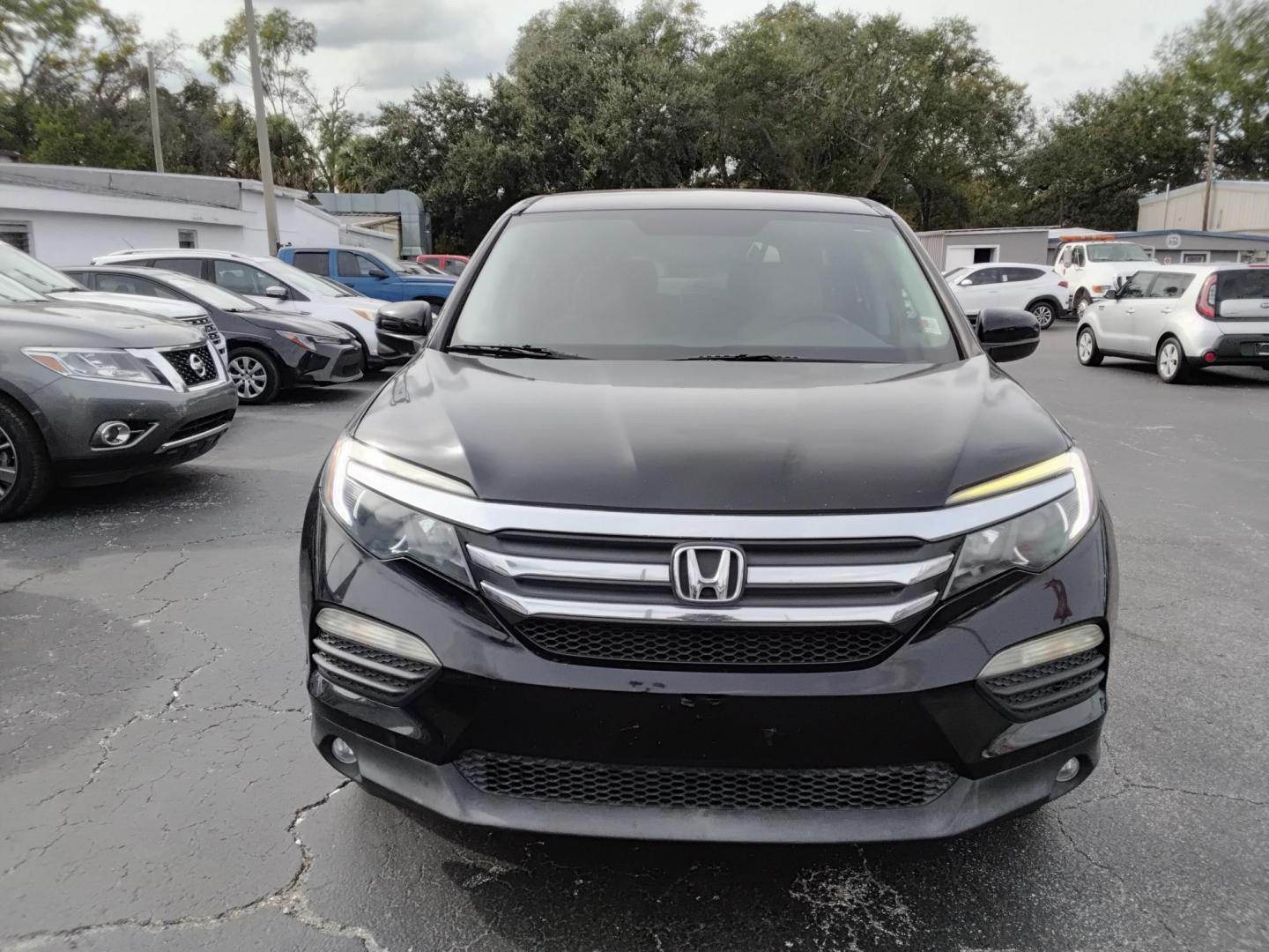 2016 BLACK /Grey Honda Pilot EX 2WD (5FNYF5H31GB) with an 3.5L V6 SOHC 24V engine, 6-Speed Automatic transmission, located at 6112 N Florida Avenue, Tampa, FL, 33604, (888) 521-5131, 27.954929, -82.459534 - $499 down plus tax & tag. - Photo#1
