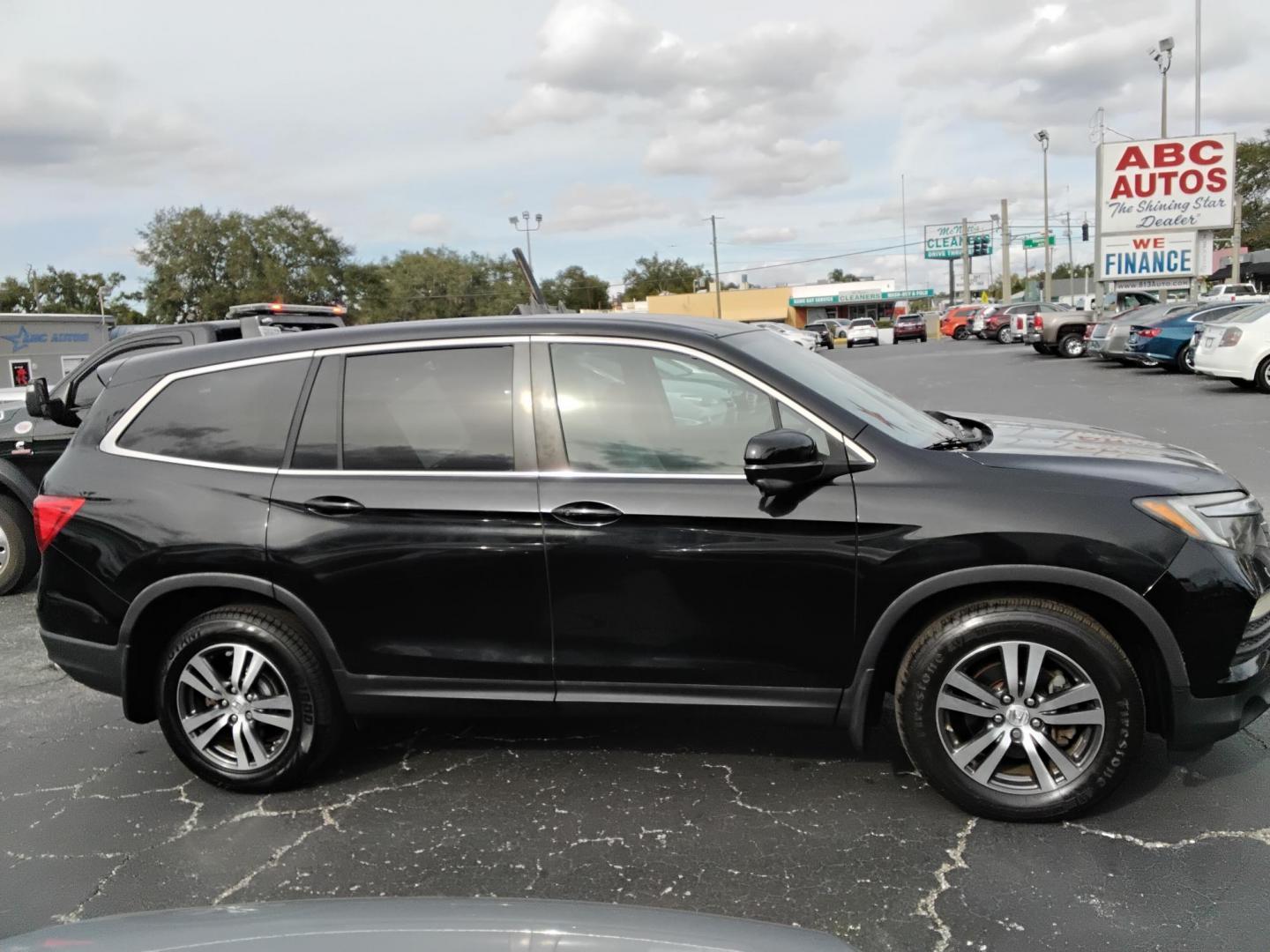 2016 BLACK /Grey Honda Pilot EX 2WD (5FNYF5H31GB) with an 3.5L V6 SOHC 24V engine, 6-Speed Automatic transmission, located at 6112 N Florida Avenue, Tampa, FL, 33604, (888) 521-5131, 27.954929, -82.459534 - $499 down plus tax & tag. - Photo#4