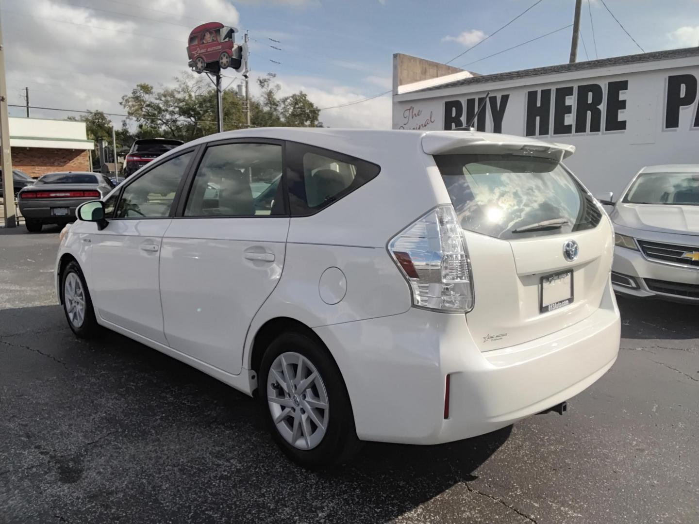 2014 White /White Toyota Prius V Three (JTDZN3EU2E3) with an 1.8L L4 DOHC 16V HYBRID engine, Continuously Variable Transmission transmission, located at 6112 N Florida Avenue, Tampa, FL, 33604, (888) 521-5131, 27.954929, -82.459534 - $499 down plus tax & tag. - Photo#4