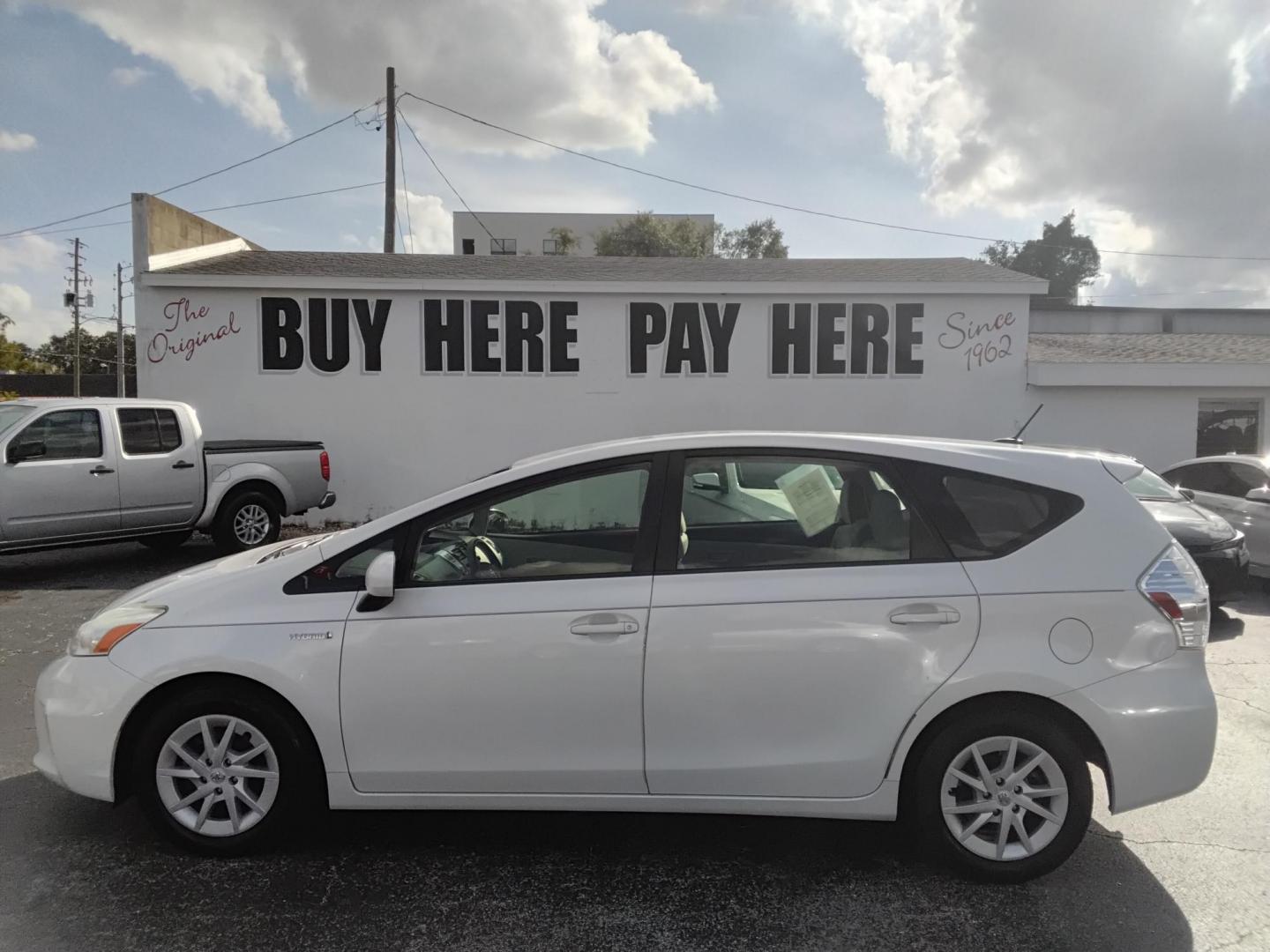 2014 White /White Toyota Prius V Three (JTDZN3EU2E3) with an 1.8L L4 DOHC 16V HYBRID engine, Continuously Variable Transmission transmission, located at 6112 N Florida Avenue, Tampa, FL, 33604, (888) 521-5131, 27.954929, -82.459534 - $499 down plus tax & tag. - Photo#0