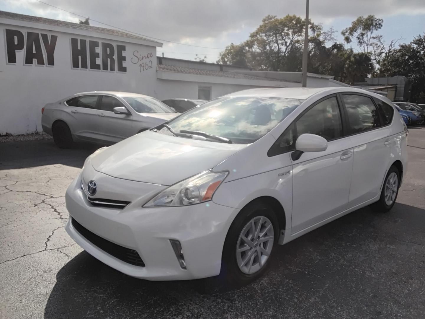 2014 White /White Toyota Prius V Three (JTDZN3EU2E3) with an 1.8L L4 DOHC 16V HYBRID engine, Continuously Variable Transmission transmission, located at 6112 N Florida Avenue, Tampa, FL, 33604, (888) 521-5131, 27.954929, -82.459534 - $499 down plus tax & tag. - Photo#2