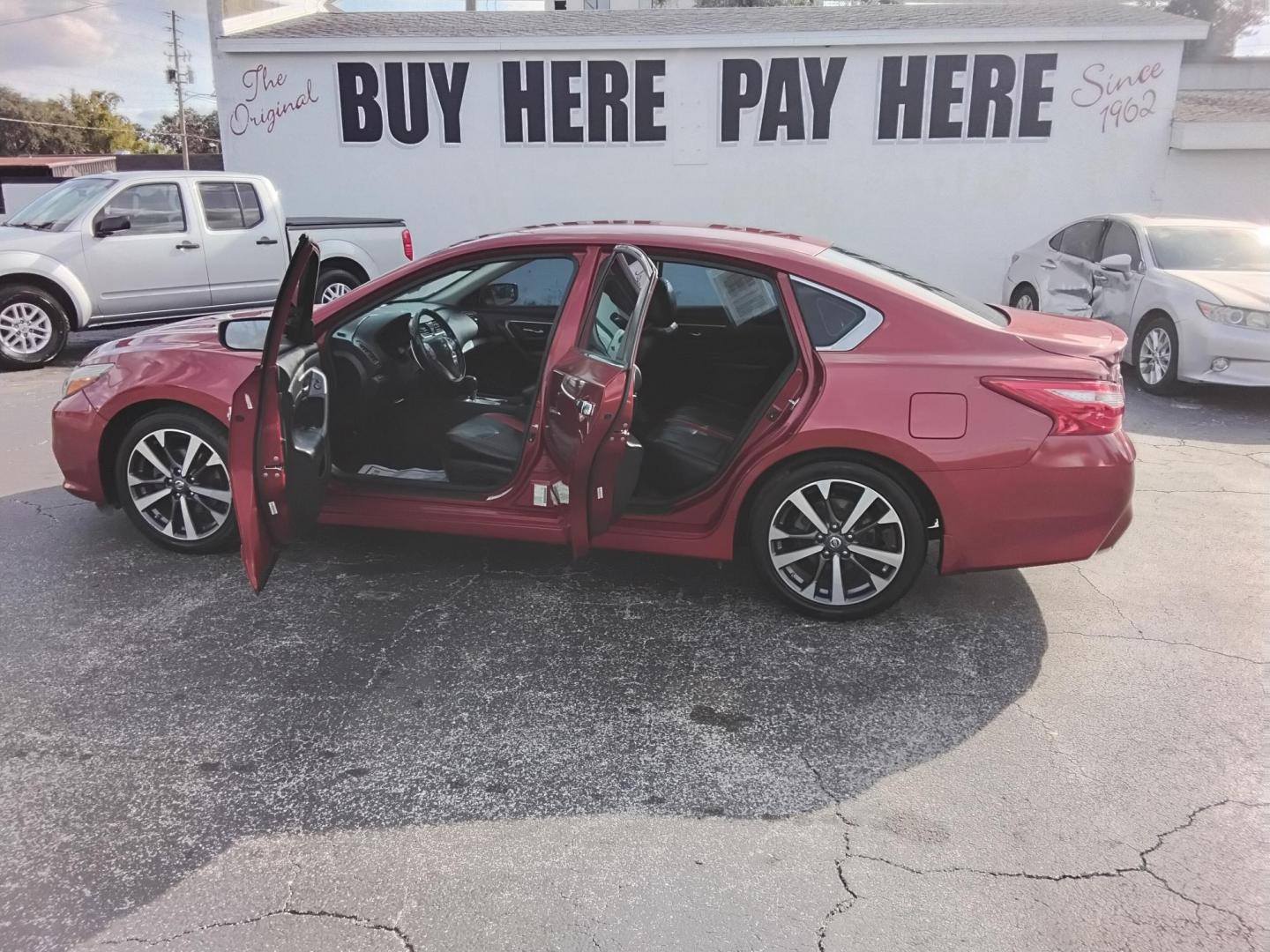 2016 RED /Grey Nissan Altima 2.5 SL (1N4AL3AP3GN) with an 2.5L L4 DOHC 16V engine, CVT transmission, located at 6112 N Florida Avenue, Tampa, FL, 33604, (888) 521-5131, 27.954929, -82.459534 - $499 down plus tax & tag. - Photo#1