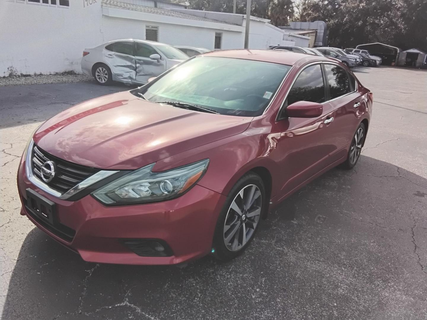 2016 RED /Grey Nissan Altima 2.5 SL (1N4AL3AP3GN) with an 2.5L L4 DOHC 16V engine, CVT transmission, located at 6112 N Florida Avenue, Tampa, FL, 33604, (888) 521-5131, 27.954929, -82.459534 - $499 down plus tax & tag. - Photo#2