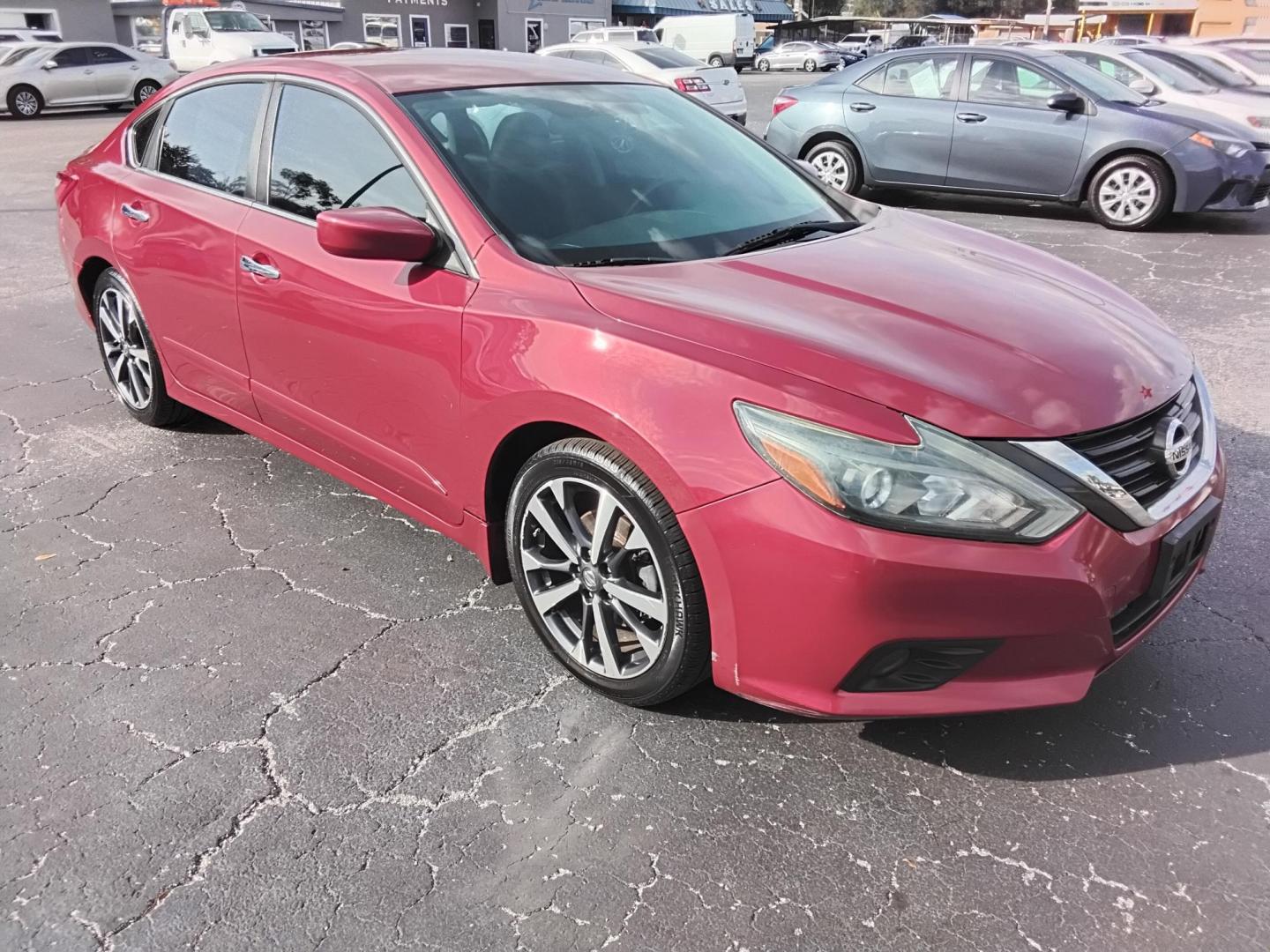 2016 RED /Grey Nissan Altima 2.5 SL (1N4AL3AP3GN) with an 2.5L L4 DOHC 16V engine, CVT transmission, located at 6112 N Florida Avenue, Tampa, FL, 33604, (888) 521-5131, 27.954929, -82.459534 - $499 down plus tax & tag. - Photo#4