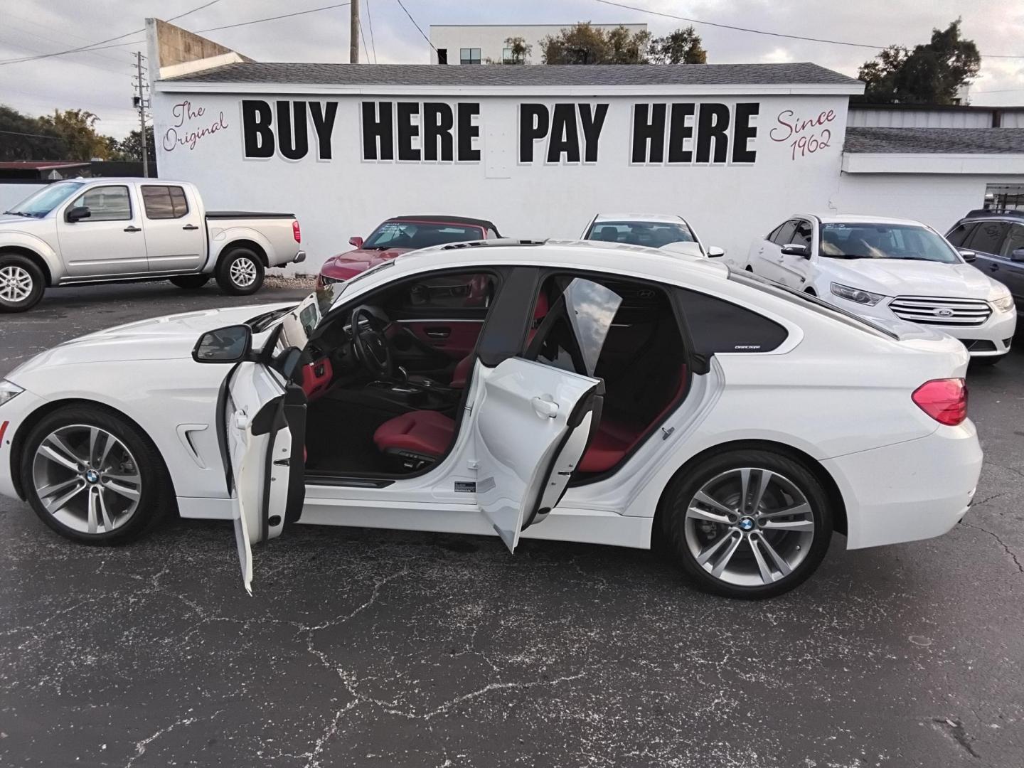 2017 White /Red BMW 4-Series Gran Coupe 430i (WBA4F7C58HG) with an 2.0L L4 DOHC 16V engine, 8A transmission, located at 6112 N Florida Avenue, Tampa, FL, 33604, (888) 521-5131, 27.954929, -82.459534 - $499 down plus tax & tag. - Photo#1