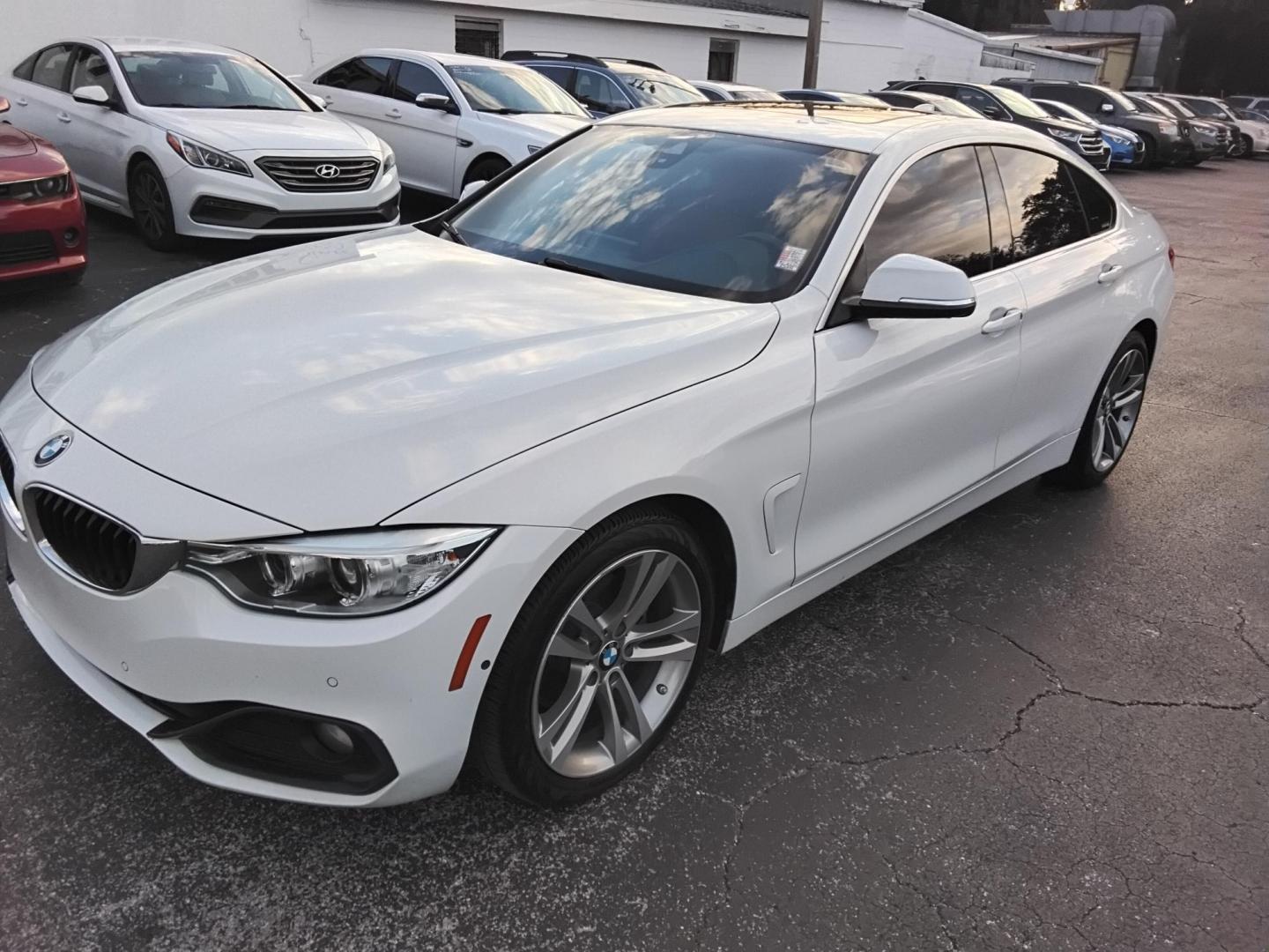 2017 White /Red BMW 4-Series Gran Coupe 430i (WBA4F7C58HG) with an 2.0L L4 DOHC 16V engine, 8A transmission, located at 6112 N Florida Avenue, Tampa, FL, 33604, (888) 521-5131, 27.954929, -82.459534 - $499 down plus tax & tag. - Photo#3
