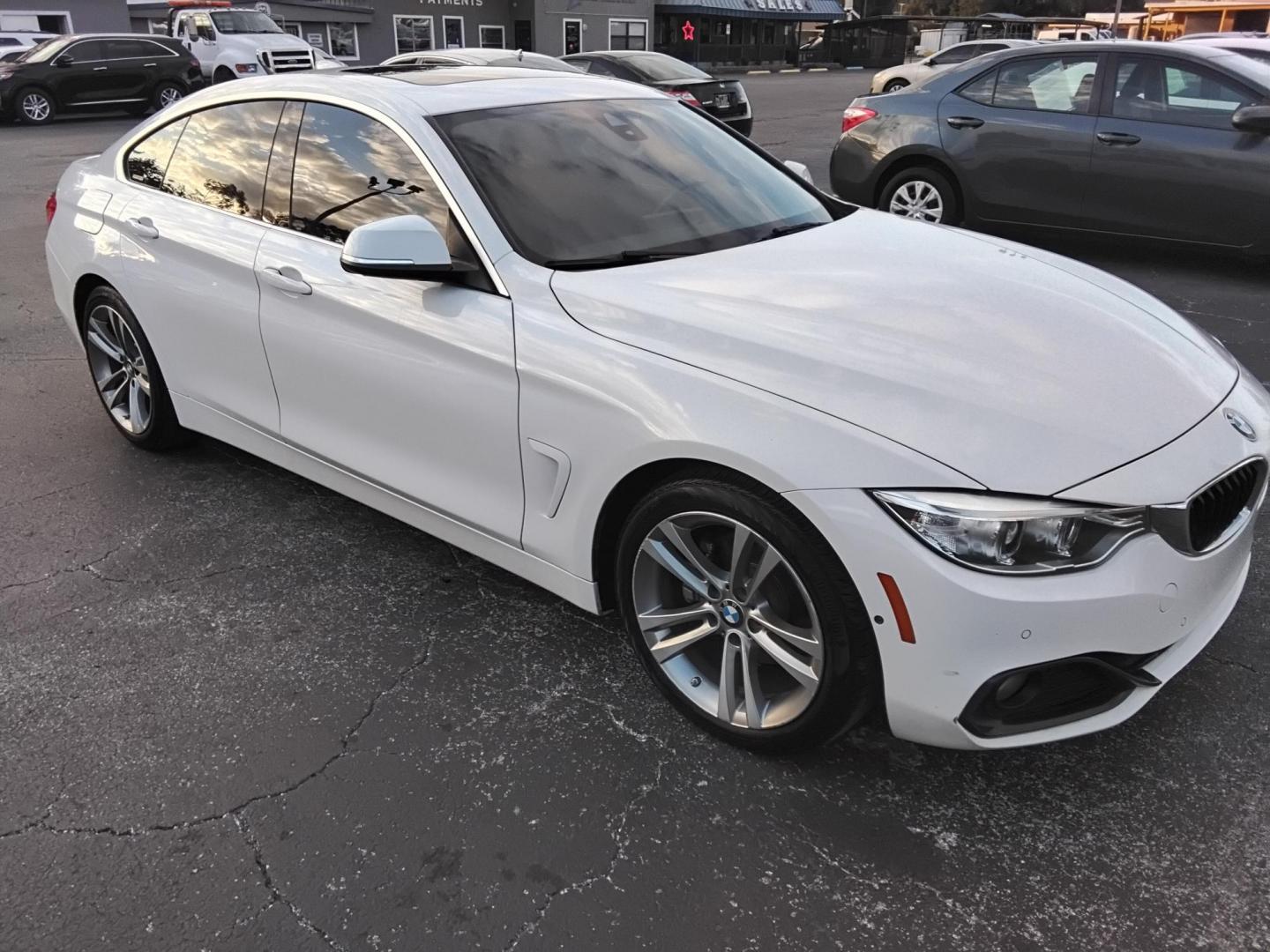 2017 White /Red BMW 4-Series Gran Coupe 430i (WBA4F7C58HG) with an 2.0L L4 DOHC 16V engine, 8A transmission, located at 6112 N Florida Avenue, Tampa, FL, 33604, (888) 521-5131, 27.954929, -82.459534 - $499 down plus tax & tag. - Photo#4