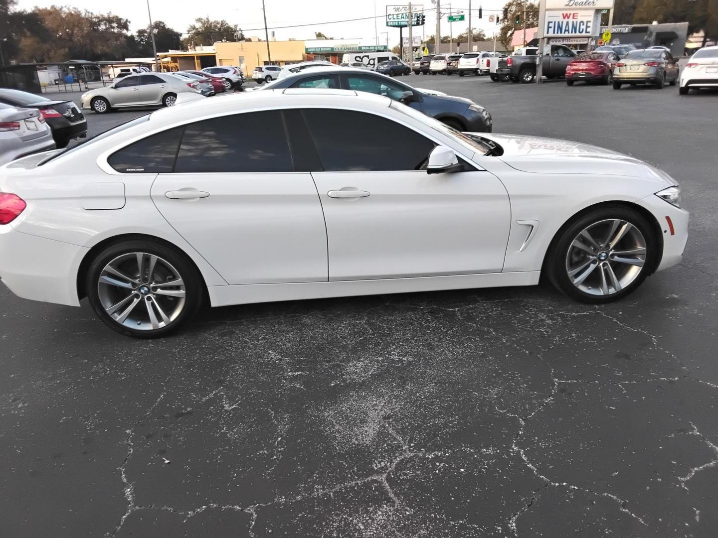 2017 White /Red BMW 4-Series Gran Coupe 430i (WBA4F7C58HG) with an 2.0L L4 DOHC 16V engine, 8A transmission, located at 6112 N Florida Avenue, Tampa, FL, 33604, (888) 521-5131, 27.954929, -82.459534 - $499 down plus tax & tag. - Photo#5