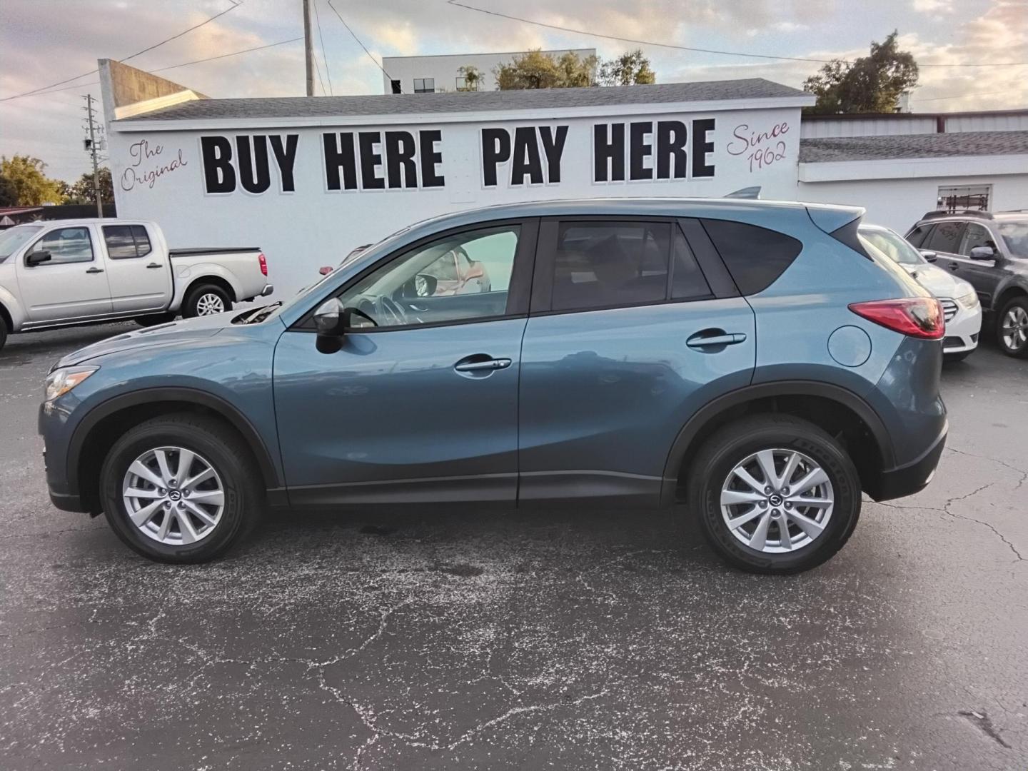 2016 BLUE /Grey Mazda CX-5 Touring (JM3KE2CY4G0) with an 2.5L L4 DOHC 16V engine, 6-Speed Automatic transmission, located at 6112 N Florida Avenue, Tampa, FL, 33604, (888) 521-5131, 27.954929, -82.459534 - $499 down plus tax & tag. - Photo#0