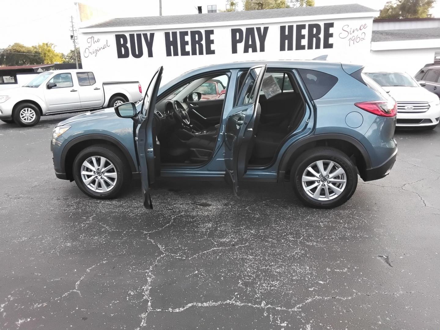2016 BLUE /Grey Mazda CX-5 Touring (JM3KE2CY4G0) with an 2.5L L4 DOHC 16V engine, 6-Speed Automatic transmission, located at 6112 N Florida Avenue, Tampa, FL, 33604, (888) 521-5131, 27.954929, -82.459534 - $499 down plus tax & tag. - Photo#1