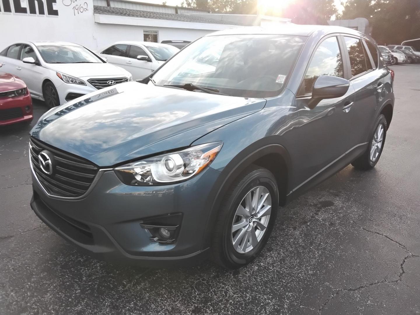 2016 BLUE /Grey Mazda CX-5 Touring (JM3KE2CY4G0) with an 2.5L L4 DOHC 16V engine, 6-Speed Automatic transmission, located at 6112 N Florida Avenue, Tampa, FL, 33604, (888) 521-5131, 27.954929, -82.459534 - $499 down plus tax & tag. - Photo#3