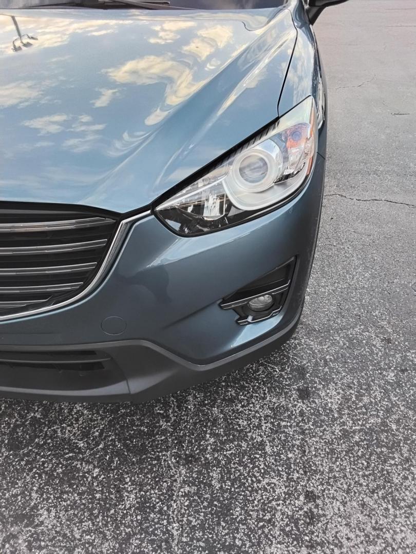 2016 BLUE /Grey Mazda CX-5 Touring (JM3KE2CY4G0) with an 2.5L L4 DOHC 16V engine, 6-Speed Automatic transmission, located at 6112 N Florida Avenue, Tampa, FL, 33604, (888) 521-5131, 27.954929, -82.459534 - $499 down plus tax & tag. - Photo#5