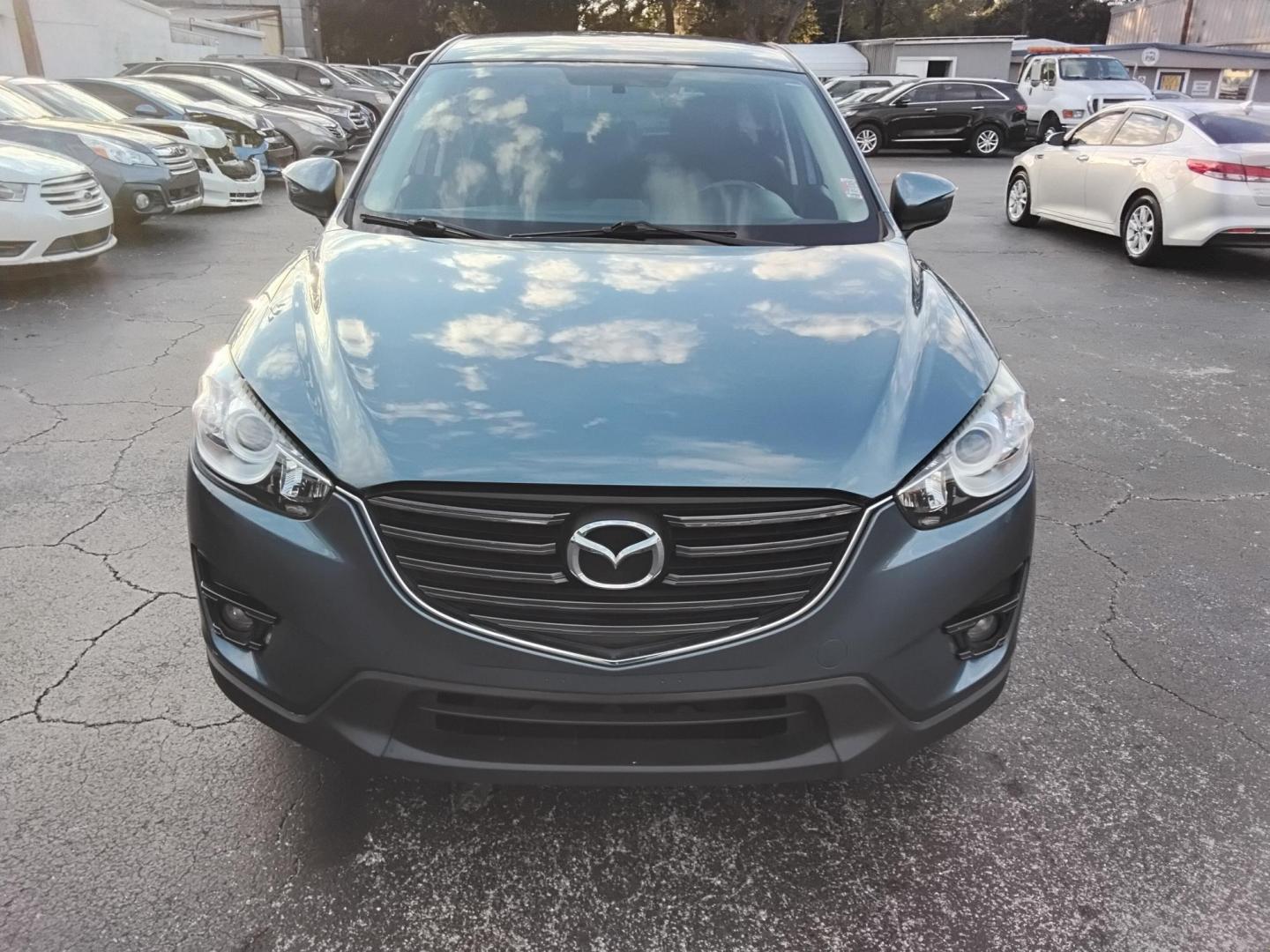 2016 BLUE /Grey Mazda CX-5 Touring (JM3KE2CY4G0) with an 2.5L L4 DOHC 16V engine, 6-Speed Automatic transmission, located at 6112 N Florida Avenue, Tampa, FL, 33604, (888) 521-5131, 27.954929, -82.459534 - $499 down plus tax & tag. - Photo#2