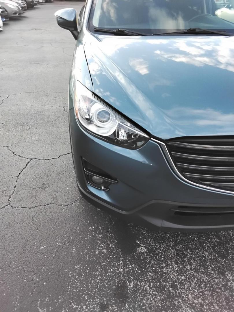 2016 BLUE /Grey Mazda CX-5 Touring (JM3KE2CY4G0) with an 2.5L L4 DOHC 16V engine, 6-Speed Automatic transmission, located at 6112 N Florida Avenue, Tampa, FL, 33604, (888) 521-5131, 27.954929, -82.459534 - $499 down plus tax & tag. - Photo#4