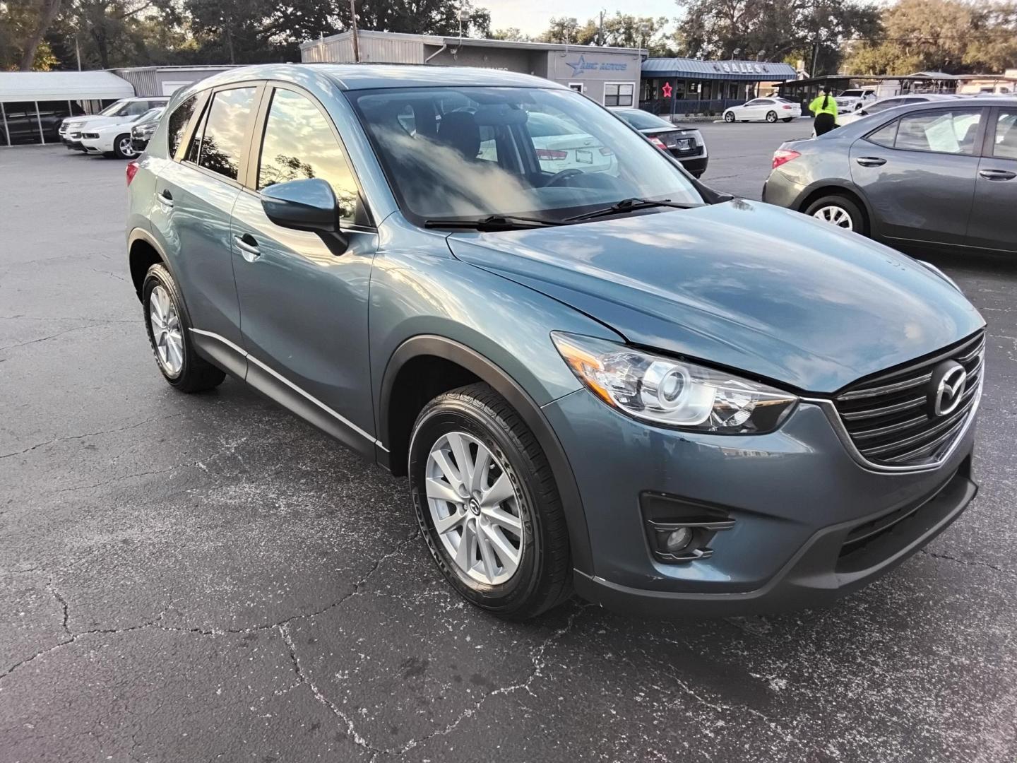 2016 BLUE /Grey Mazda CX-5 Touring (JM3KE2CY4G0) with an 2.5L L4 DOHC 16V engine, 6-Speed Automatic transmission, located at 6112 N Florida Avenue, Tampa, FL, 33604, (888) 521-5131, 27.954929, -82.459534 - $499 down plus tax & tag. - Photo#6