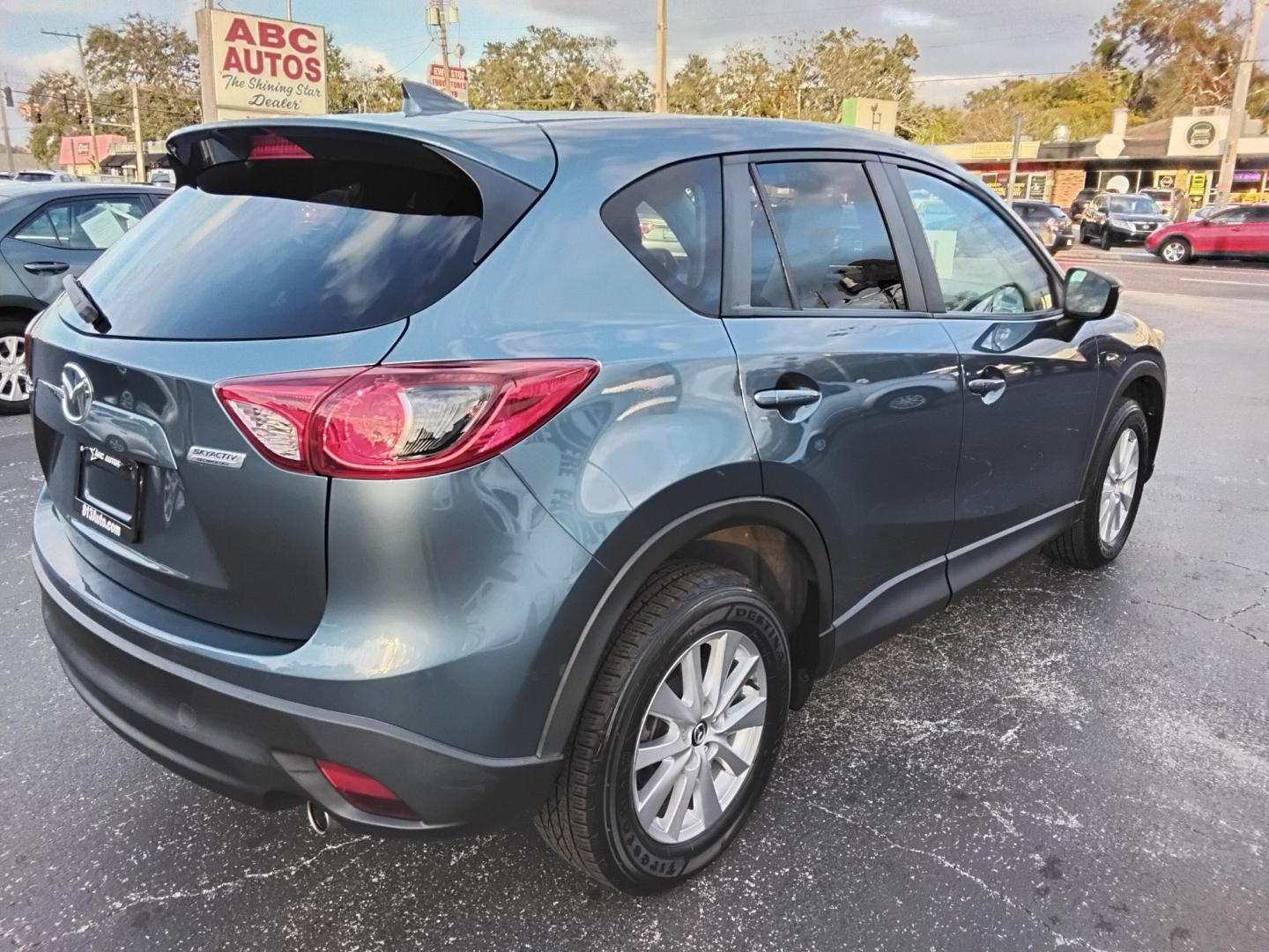 2016 BLUE /Grey Mazda CX-5 Touring (JM3KE2CY4G0) with an 2.5L L4 DOHC 16V engine, 6-Speed Automatic transmission, located at 6112 N Florida Avenue, Tampa, FL, 33604, (888) 521-5131, 27.954929, -82.459534 - $499 down plus tax & tag. - Photo#8