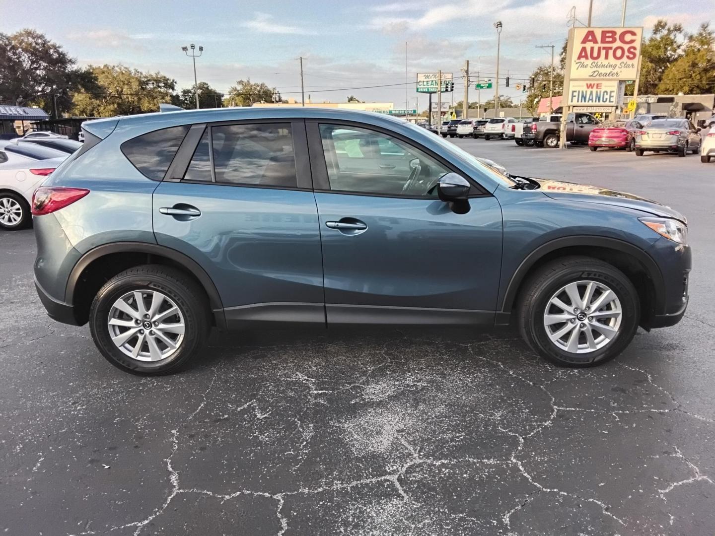 2016 BLUE /Grey Mazda CX-5 Touring (JM3KE2CY4G0) with an 2.5L L4 DOHC 16V engine, 6-Speed Automatic transmission, located at 6112 N Florida Avenue, Tampa, FL, 33604, (888) 521-5131, 27.954929, -82.459534 - $499 down plus tax & tag. - Photo#7