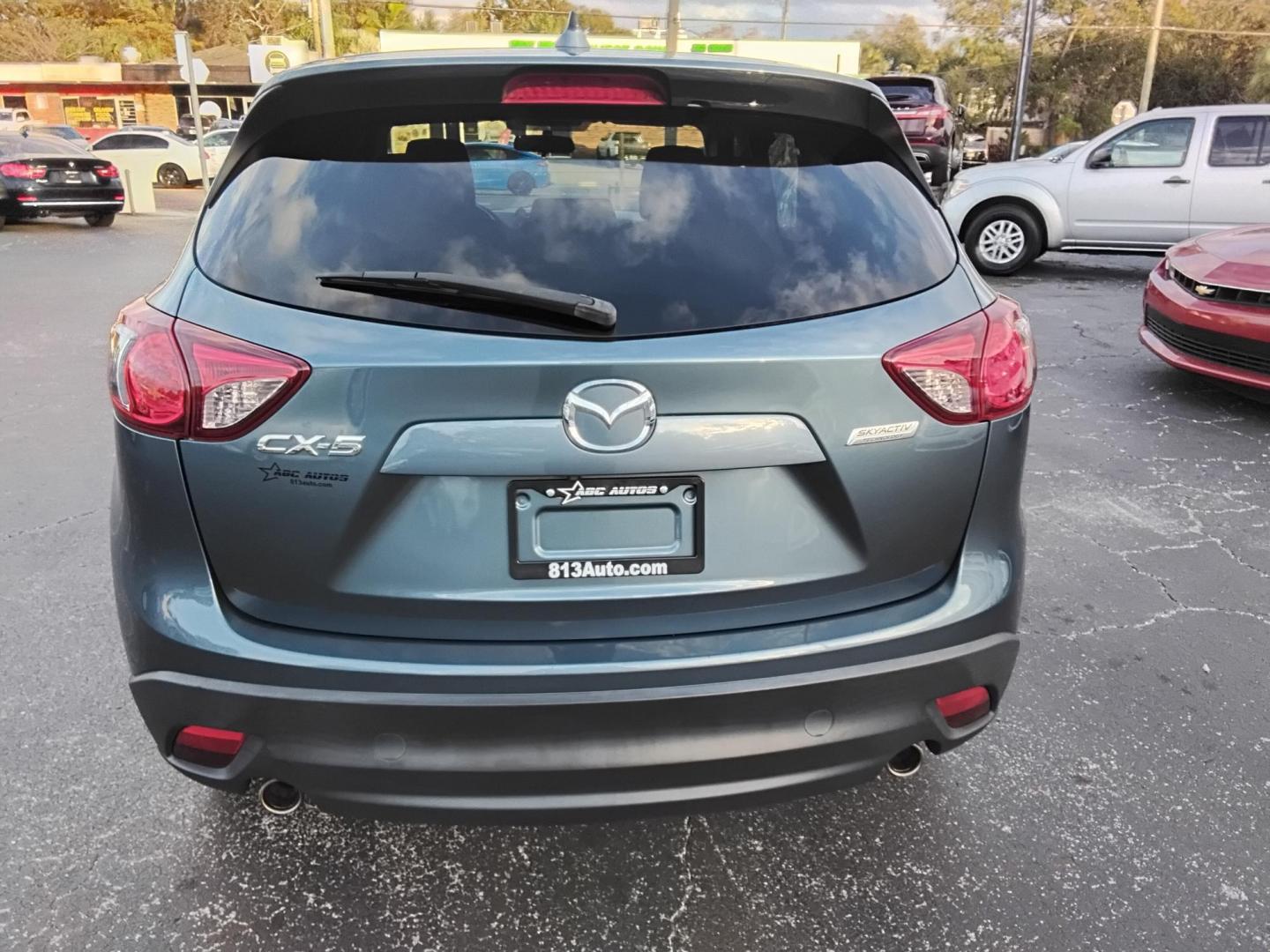 2016 BLUE /Grey Mazda CX-5 Touring (JM3KE2CY4G0) with an 2.5L L4 DOHC 16V engine, 6-Speed Automatic transmission, located at 6112 N Florida Avenue, Tampa, FL, 33604, (888) 521-5131, 27.954929, -82.459534 - $499 down plus tax & tag. - Photo#12