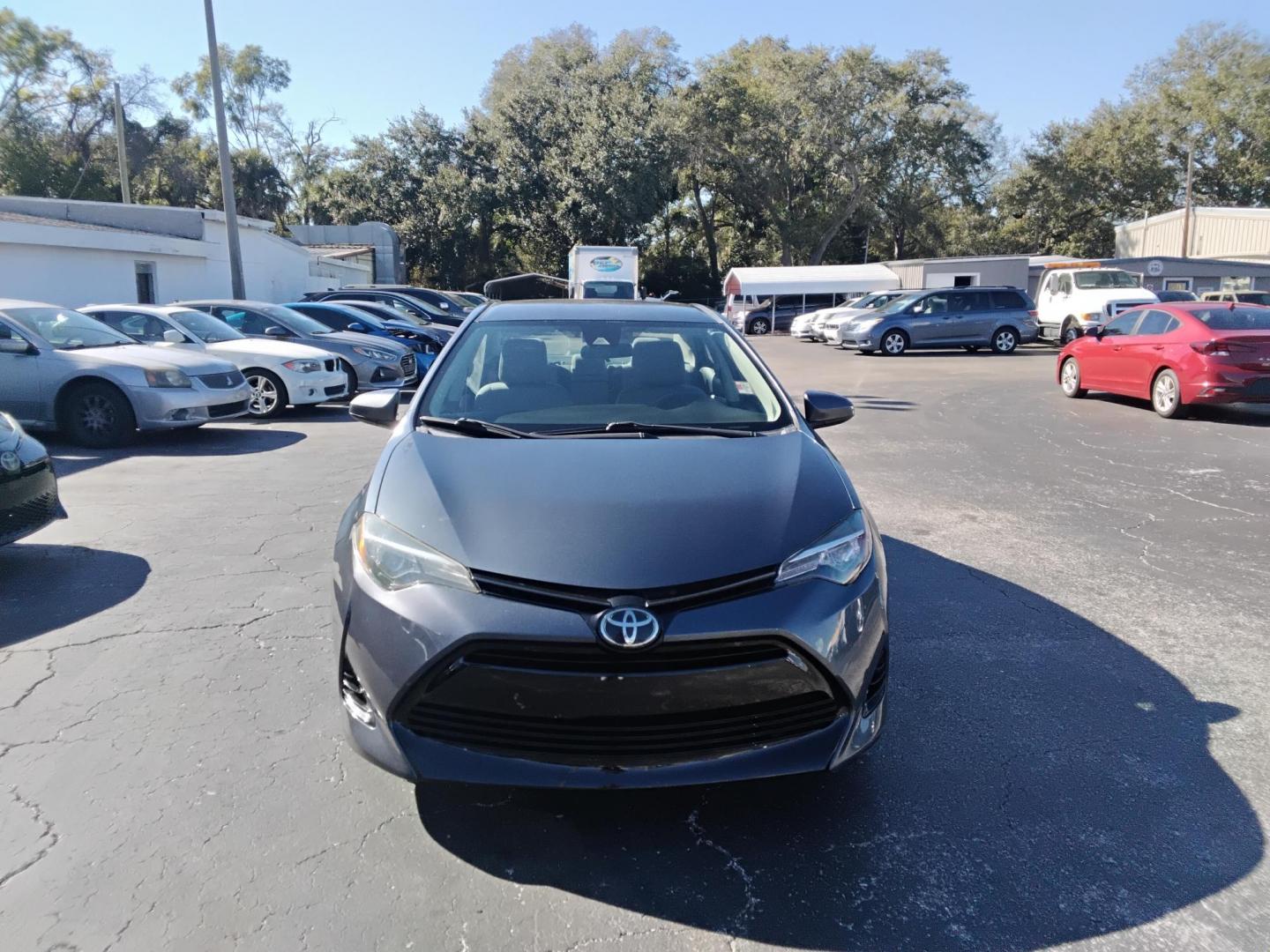 2017 GRAY /grey Toyota Corolla L CVT (2T1BURHE1HC) with an 1.8L L4 DOHC 16V engine, CVT transmission, located at 6112 N Florida Avenue, Tampa, FL, 33604, (888) 521-5131, 27.954929, -82.459534 - $499 down plus tax & tag. - Photo#1