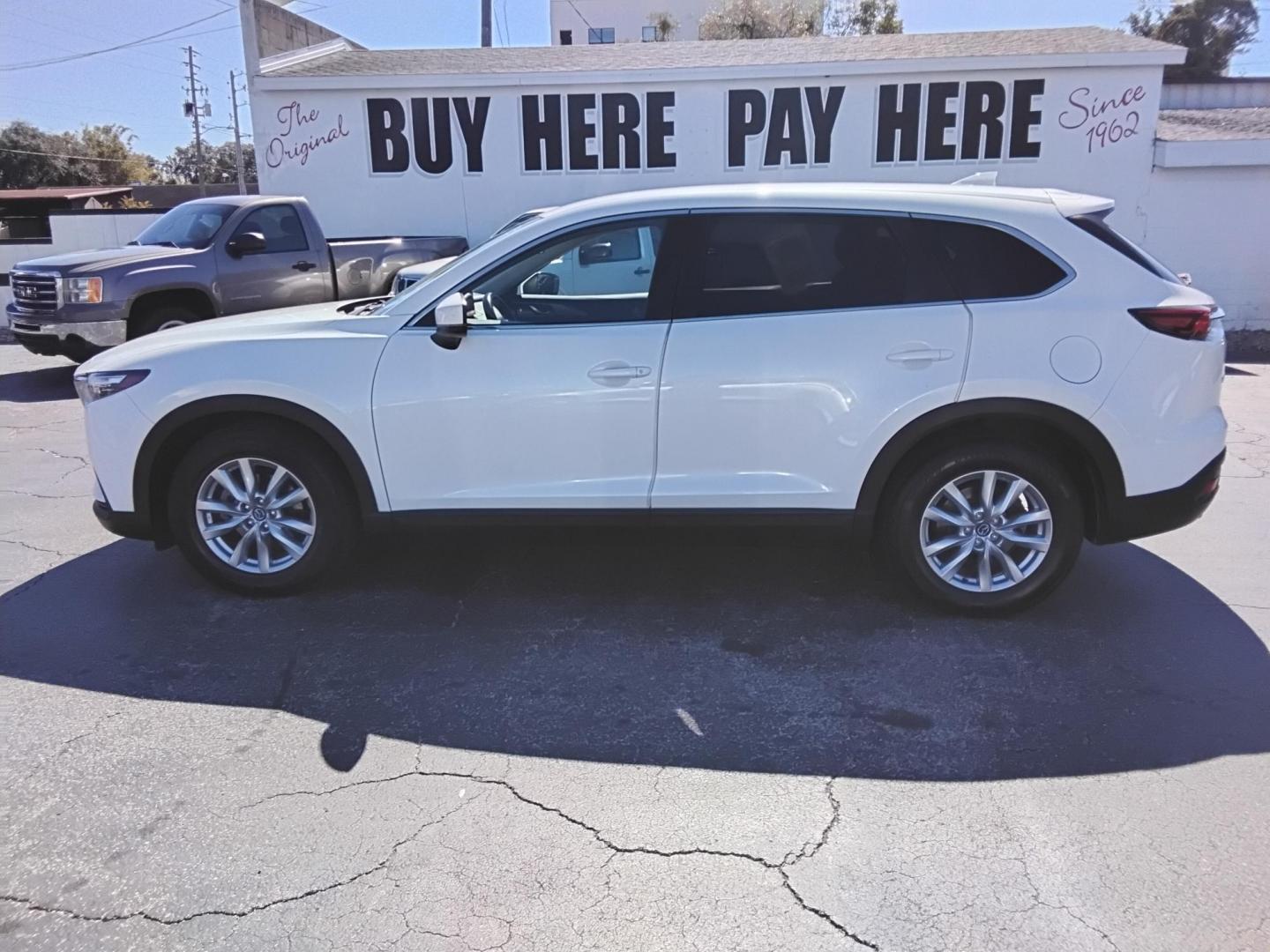 2016 White /Grey Mazda CX-9 Sport FWD (JM3TCABY9G0) with an 2.5L L4 DOHC 16V engine, 6A transmission, located at 6112 N Florida Avenue, Tampa, FL, 33604, (888) 521-5131, 27.954929, -82.459534 - $499 DOWN PLUS TAX & TAG. - Photo#0