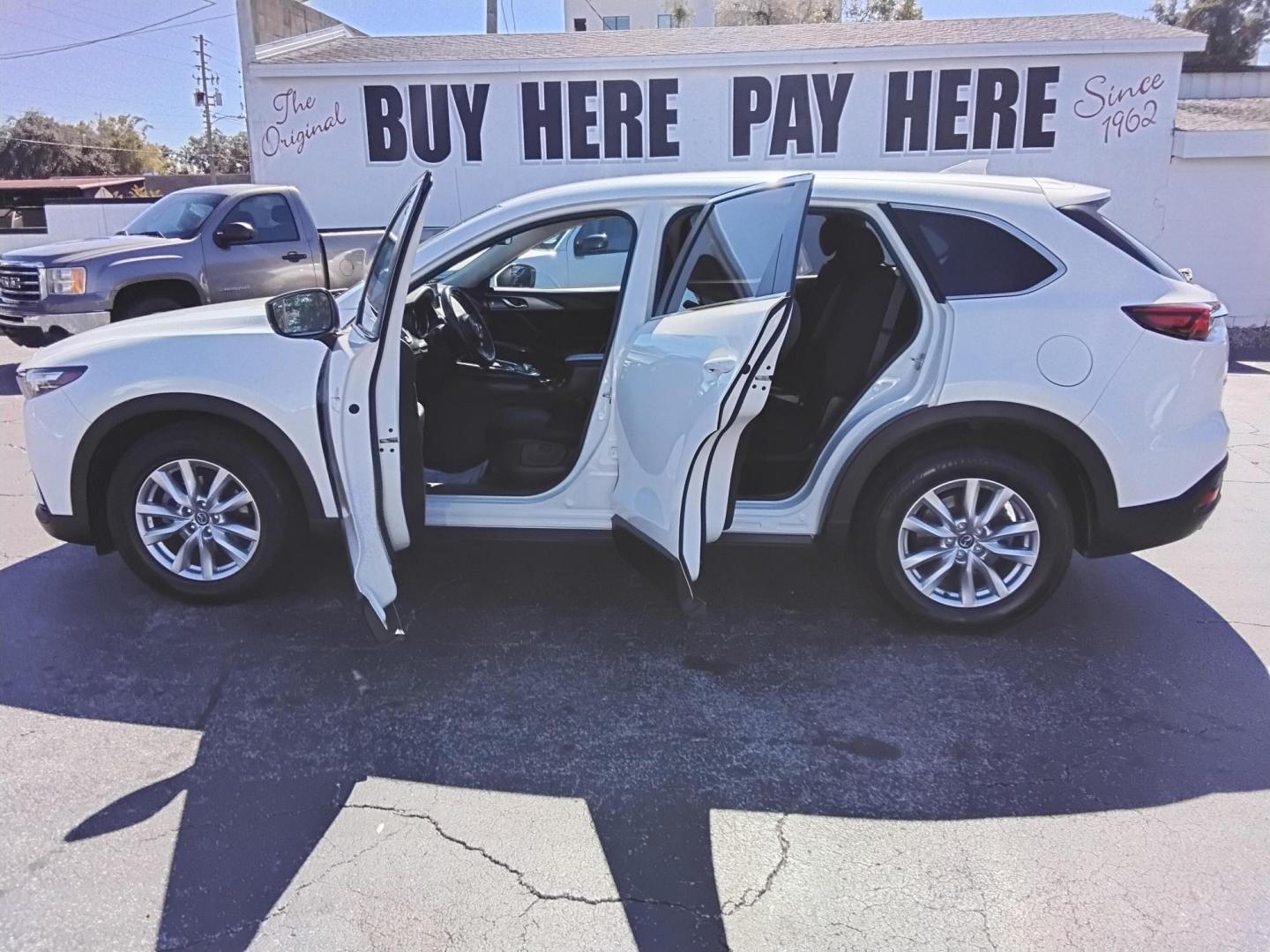 2016 White /Grey Mazda CX-9 Sport FWD (JM3TCABY9G0) with an 2.5L L4 DOHC 16V engine, 6A transmission, located at 6112 N Florida Avenue, Tampa, FL, 33604, (888) 521-5131, 27.954929, -82.459534 - $499 DOWN PLUS TAX & TAG. - Photo#1