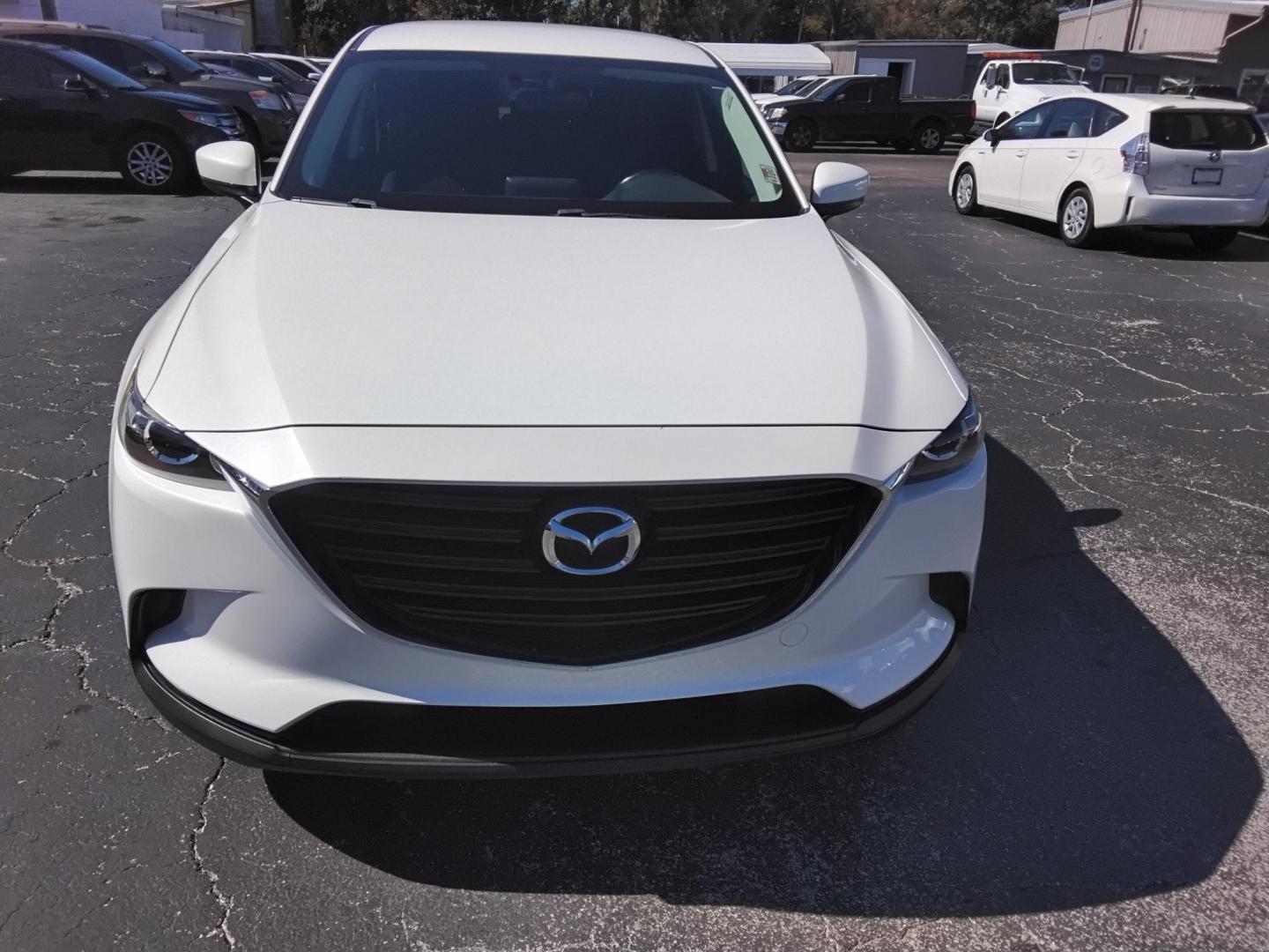2016 White /Grey Mazda CX-9 Sport FWD (JM3TCABY9G0) with an 2.5L L4 DOHC 16V engine, 6A transmission, located at 6112 N Florida Avenue, Tampa, FL, 33604, (888) 521-5131, 27.954929, -82.459534 - $499 DOWN PLUS TAX & TAG.- Photo#2