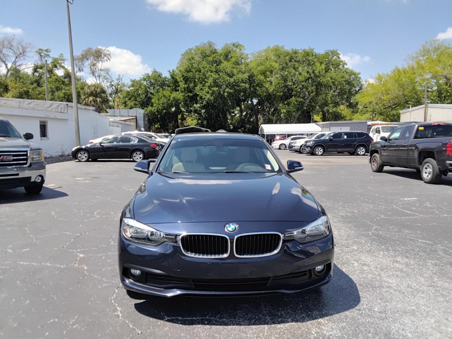 2017 BLUE /Beige BMW 3-Series 320i Sedan (WBA8A9C35HA) with an 2.0L L4 DOHC 16V engine, 8A transmission, located at 6112 N Florida Avenue, Tampa, FL, 33604, (888) 521-5131, 27.954929, -82.459534 - $499 down plus tax & tag. - Photo#1