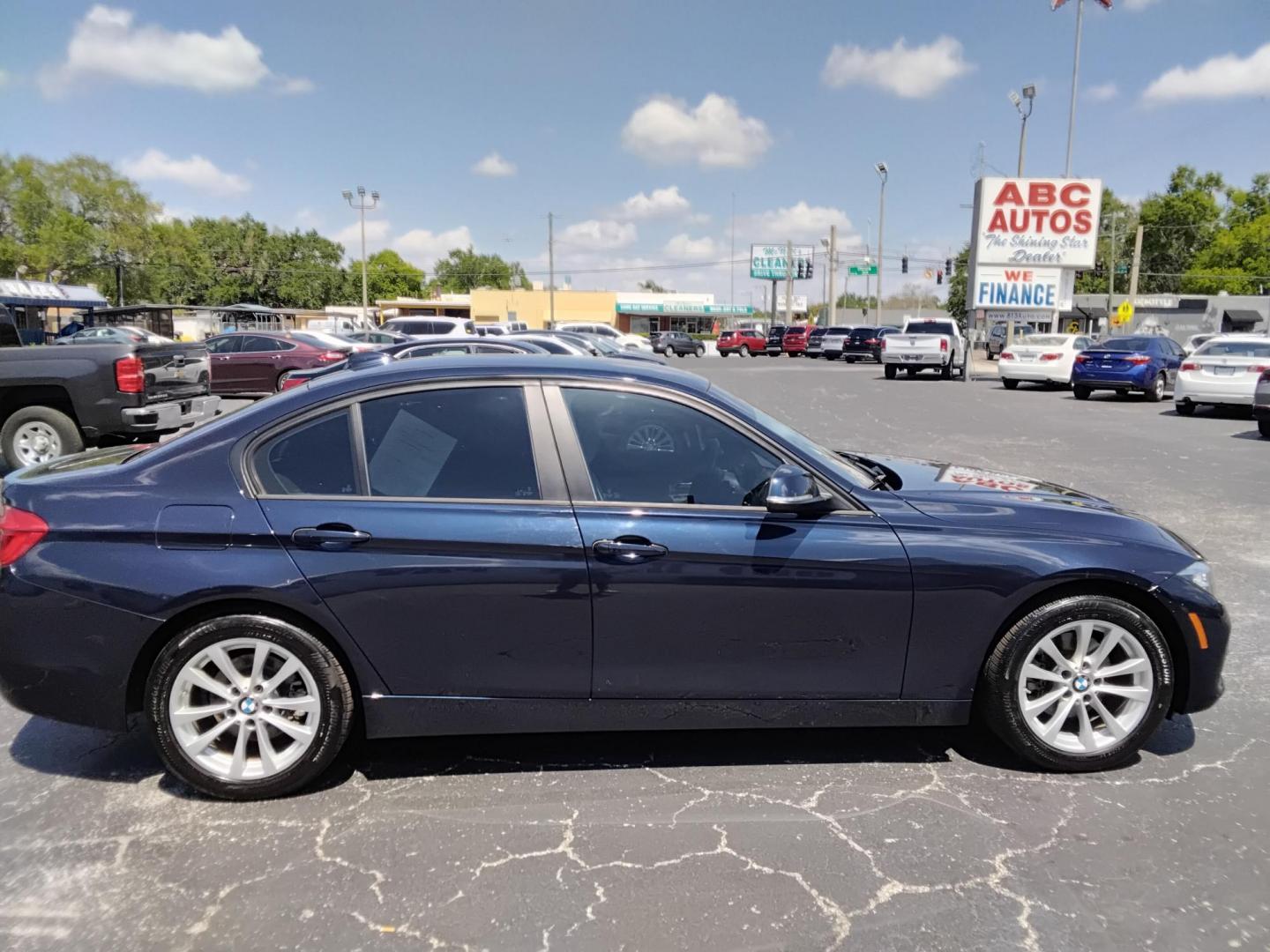2017 BLUE /Beige BMW 3-Series 320i Sedan (WBA8A9C35HA) with an 2.0L L4 DOHC 16V engine, 8A transmission, located at 6112 N Florida Avenue, Tampa, FL, 33604, (888) 521-5131, 27.954929, -82.459534 - $499 down plus tax & tag. - Photo#2