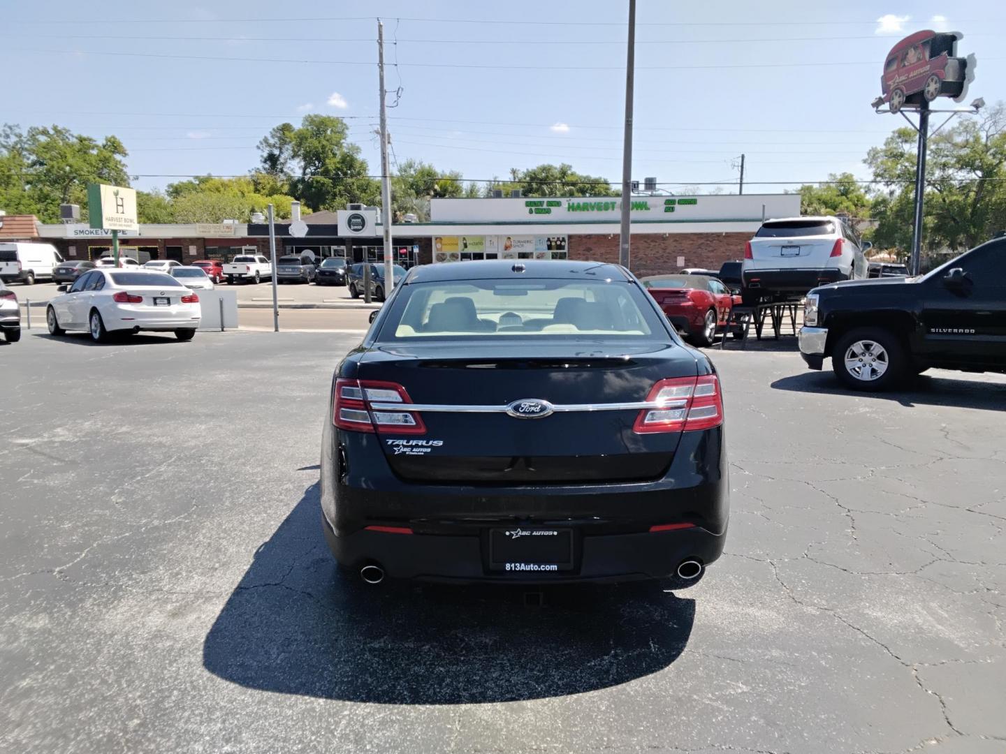 2017 BLACK /Beige Ford Taurus SE FWD (1FAHP2D85HG) with an 3.5L V6 DOHC 24V engine, 6A transmission, located at 6112 N Florida Avenue, Tampa, FL, 33604, (888) 521-5131, 27.954929, -82.459534 - $499 down plus tax & tag. - Photo#3