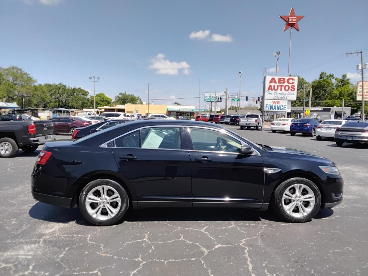 2017 BLACK /Beige Ford Taurus SE FWD (1FAHP2D85HG) with an 3.5L V6 DOHC 24V engine, 6A transmission, located at 6112 N Florida Avenue, Tampa, FL, 33604, (888) 521-5131, 27.954929, -82.459534 - $499 down plus tax & tag. - Photo#2
