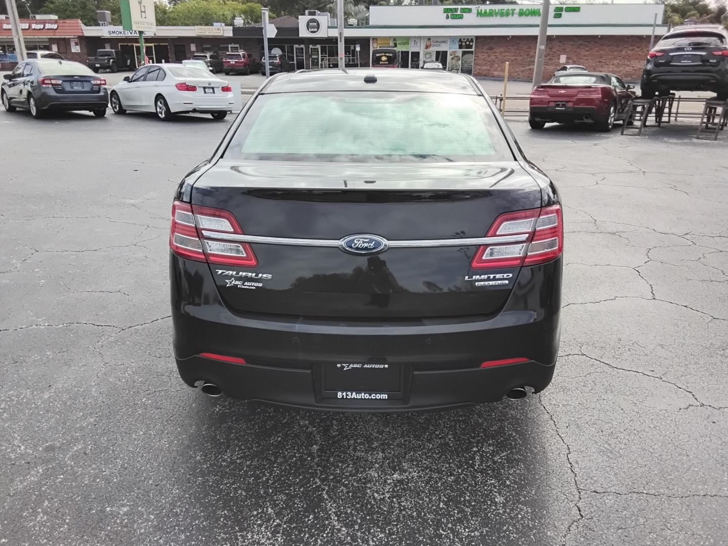 2015 BLACK /Beige Ford Taurus Limited FWD (1FAHP2F80FG) with an 3.5L V6 DOHC 24V engine, 6-Speed Automatic transmission, located at 6112 N Florida Avenue, Tampa, FL, 33604, (888) 521-5131, 27.954929, -82.459534 - $499 DOWN PLUS TAX & TAG. - Photo#6