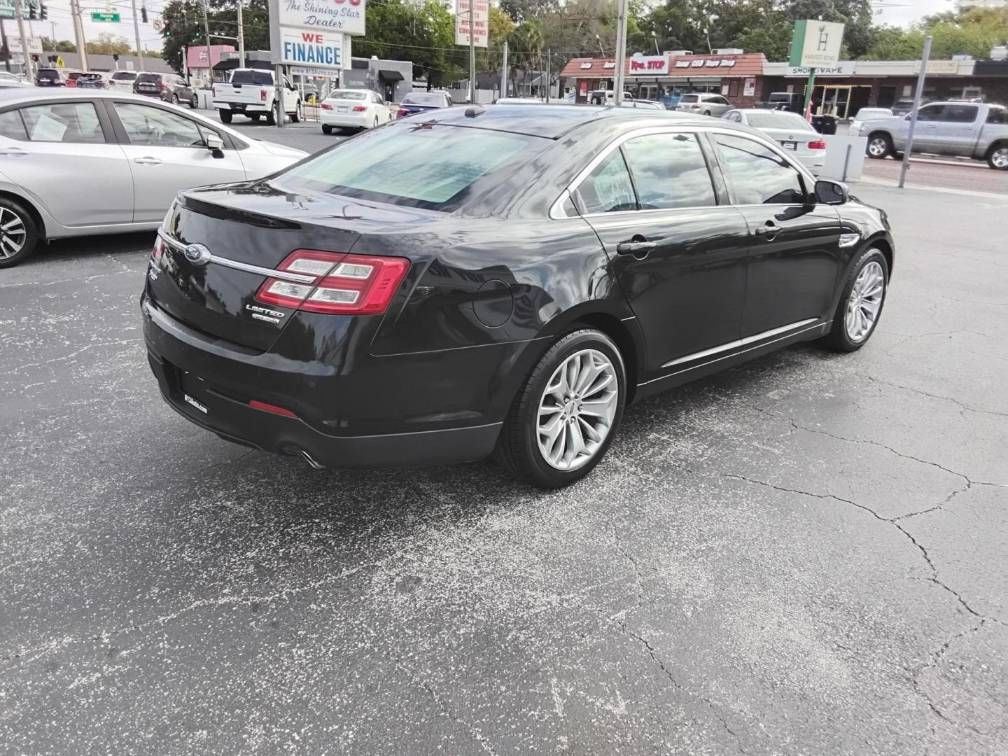 2015 BLACK /Beige Ford Taurus Limited FWD (1FAHP2F80FG) with an 3.5L V6 DOHC 24V engine, 6-Speed Automatic transmission, located at 6112 N Florida Avenue, Tampa, FL, 33604, (888) 521-5131, 27.954929, -82.459534 - $499 DOWN PLUS TAX & TAG. - Photo#5