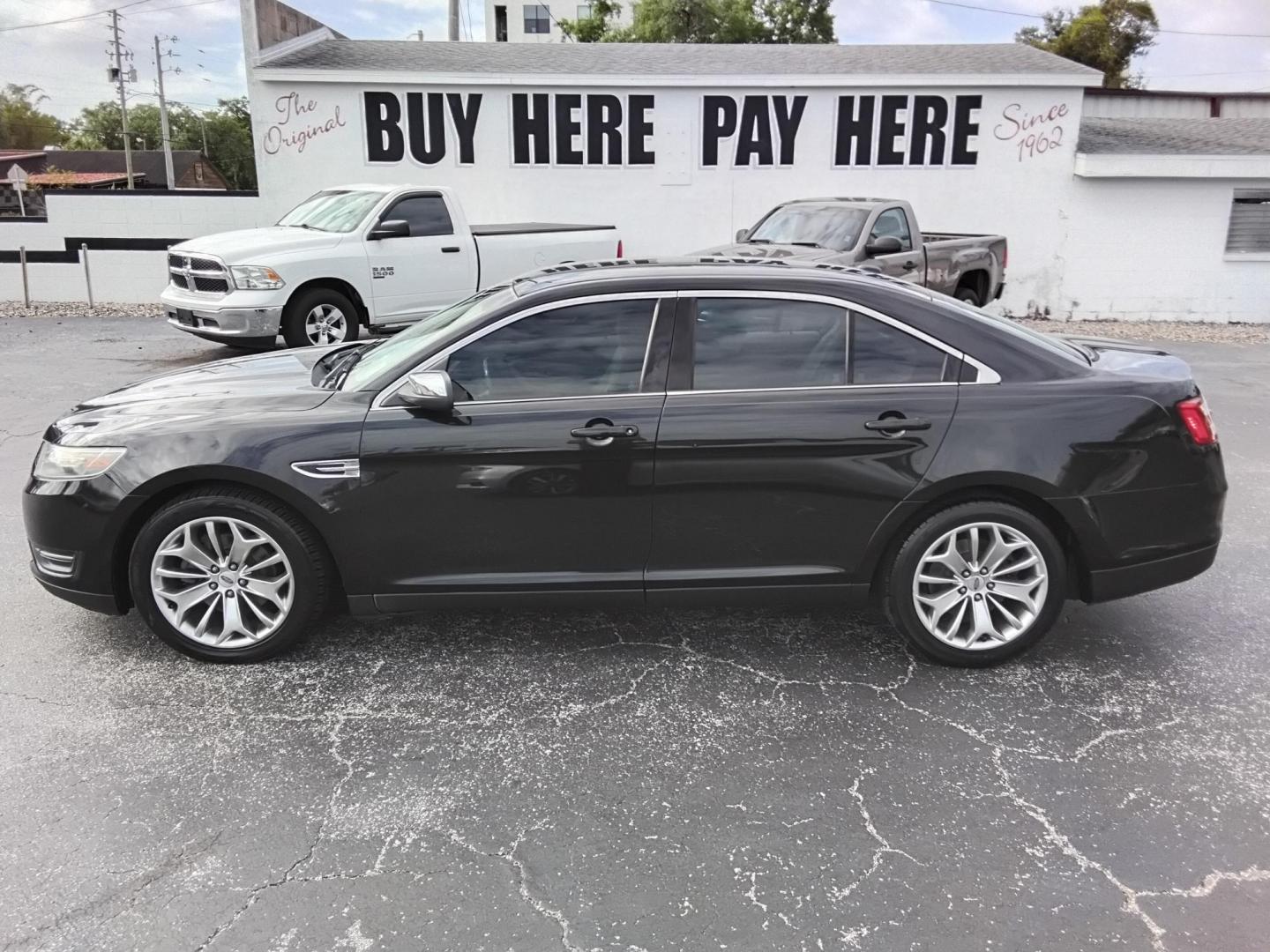 2015 BLACK /Beige Ford Taurus Limited FWD (1FAHP2F80FG) with an 3.5L V6 DOHC 24V engine, 6-Speed Automatic transmission, located at 6112 N Florida Avenue, Tampa, FL, 33604, (888) 521-5131, 27.954929, -82.459534 - $499 DOWN PLUS TAX & TAG. - Photo#0