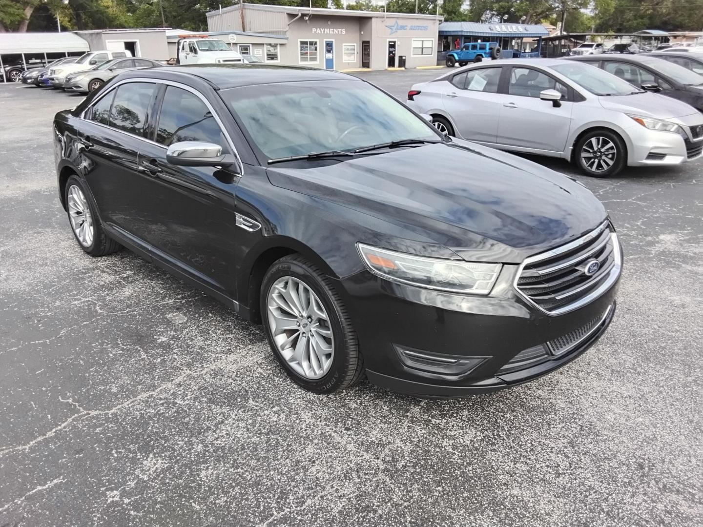 2015 BLACK /Beige Ford Taurus Limited FWD (1FAHP2F80FG) with an 3.5L V6 DOHC 24V engine, 6-Speed Automatic transmission, located at 6112 N Florida Avenue, Tampa, FL, 33604, (888) 521-5131, 27.954929, -82.459534 - $499 DOWN PLUS TAX & TAG. - Photo#2