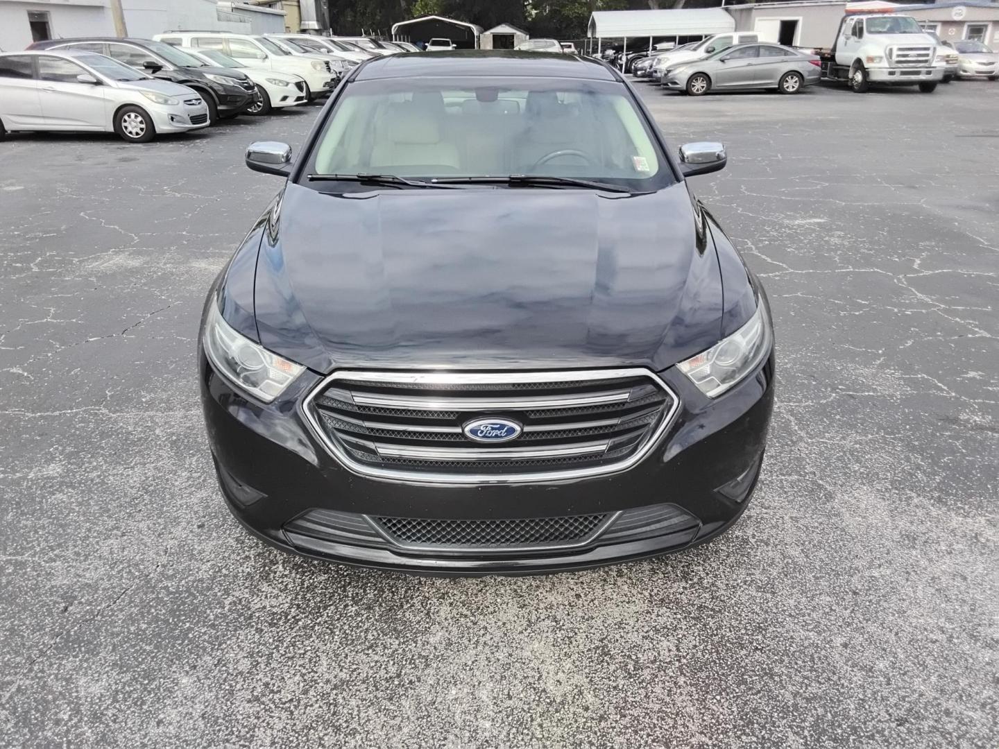 2015 BLACK /Beige Ford Taurus Limited FWD (1FAHP2F80FG) with an 3.5L V6 DOHC 24V engine, 6-Speed Automatic transmission, located at 6112 N Florida Avenue, Tampa, FL, 33604, (888) 521-5131, 27.954929, -82.459534 - $499 DOWN PLUS TAX & TAG. - Photo#3