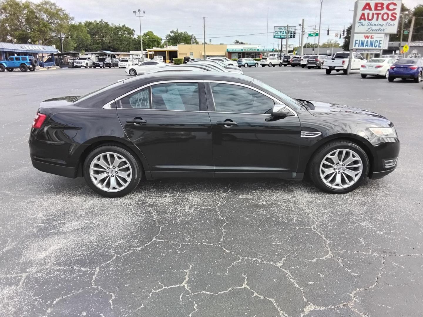 2015 BLACK /Beige Ford Taurus Limited FWD (1FAHP2F80FG) with an 3.5L V6 DOHC 24V engine, 6-Speed Automatic transmission, located at 6112 N Florida Avenue, Tampa, FL, 33604, (888) 521-5131, 27.954929, -82.459534 - $499 DOWN PLUS TAX & TAG. - Photo#4