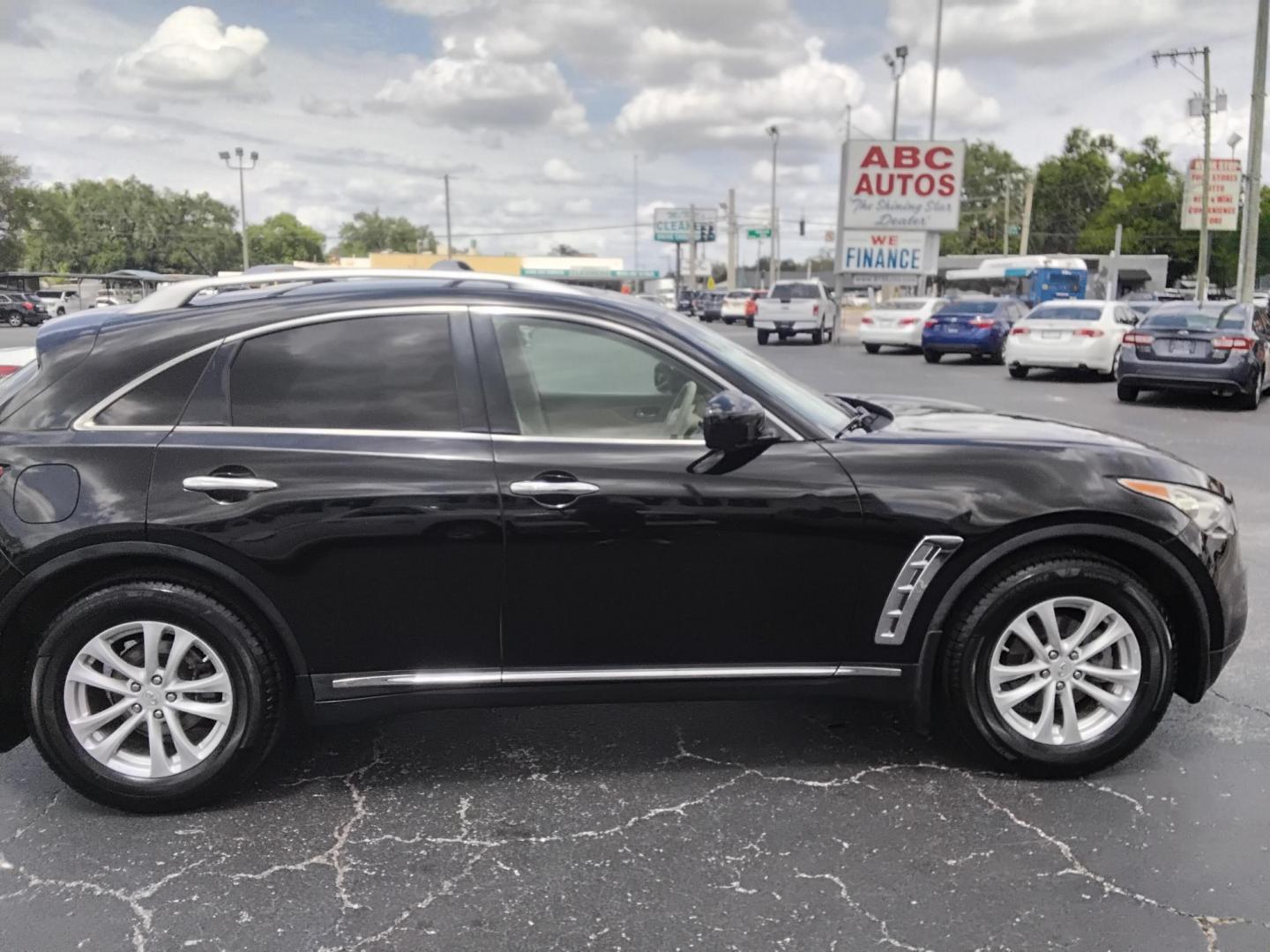 2012 BLACK /Beige Infiniti FX FX35 2WD (JN8AS1MU8CM) with an 3.5L V6 DOHC 24V engine, 5-Speed Automatic transmission, located at 6112 N Florida Avenue, Tampa, FL, 33604, (888) 521-5131, 27.954929, -82.459534 - $499 DOWN PLUS TAX & TAG. - Photo#2