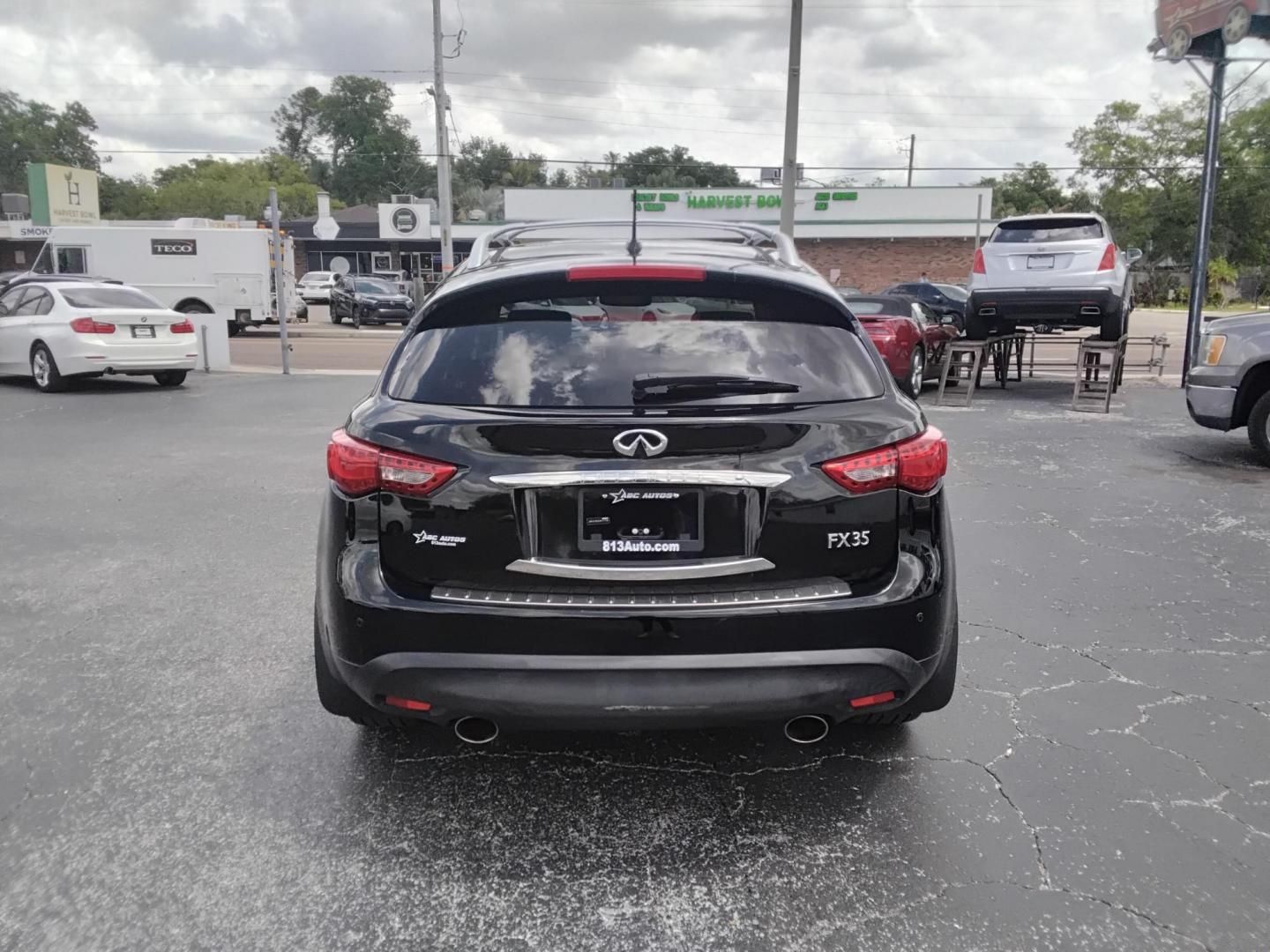 2012 BLACK /Beige Infiniti FX FX35 2WD (JN8AS1MU8CM) with an 3.5L V6 DOHC 24V engine, 5-Speed Automatic transmission, located at 6112 N Florida Avenue, Tampa, FL, 33604, (888) 521-5131, 27.954929, -82.459534 - $499 DOWN PLUS TAX & TAG. - Photo#3
