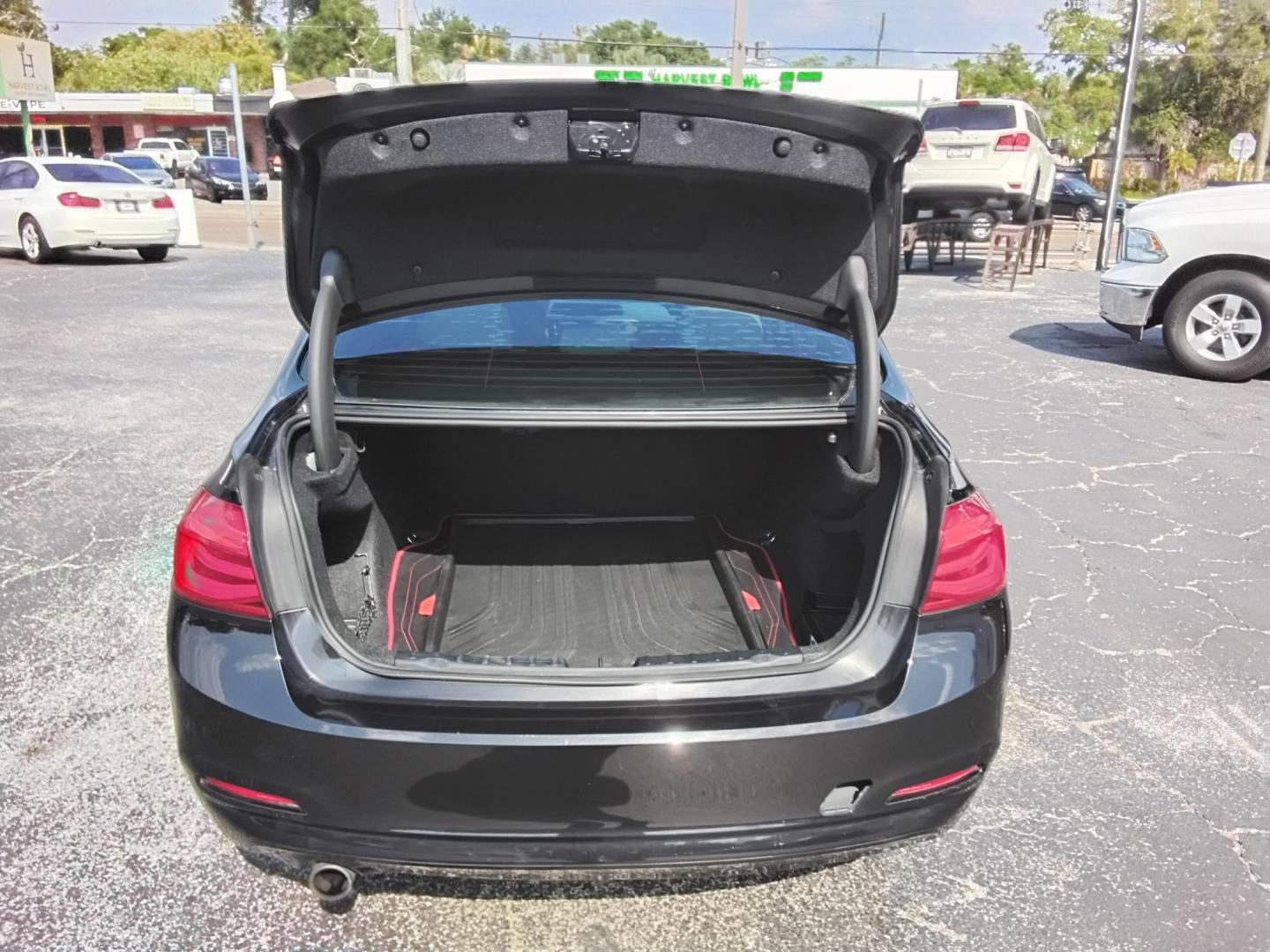 2018 BLACK /Beige BMW 3-Series 320i Sedan (WBA8A9C58JA) with an 2.0L L4 DOHC 16V engine, 8A transmission, located at 6112 N Florida Avenue, Tampa, FL, 33604, (888) 521-5131, 27.954929, -82.459534 - $499 DOWN PLUS TAX & TAG. - Photo#13