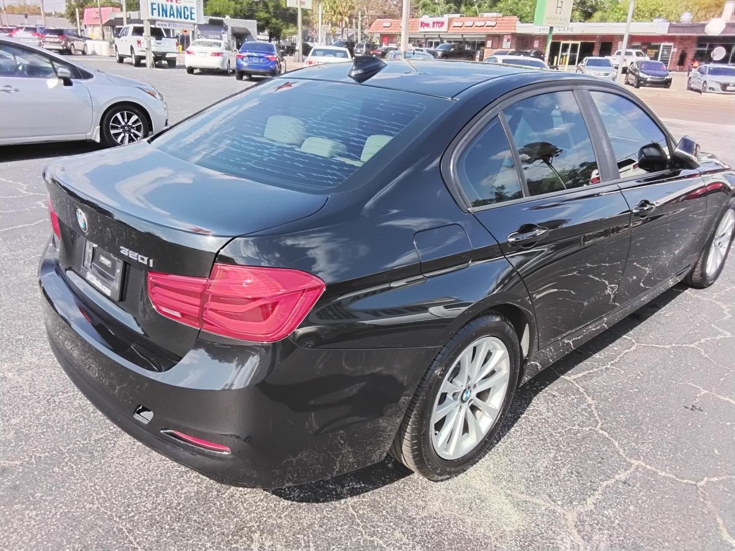2018 BLACK /Beige BMW 3-Series 320i Sedan (WBA8A9C58JA) with an 2.0L L4 DOHC 16V engine, 8A transmission, located at 6112 N Florida Avenue, Tampa, FL, 33604, (888) 521-5131, 27.954929, -82.459534 - $499 DOWN PLUS TAX & TAG. - Photo#12
