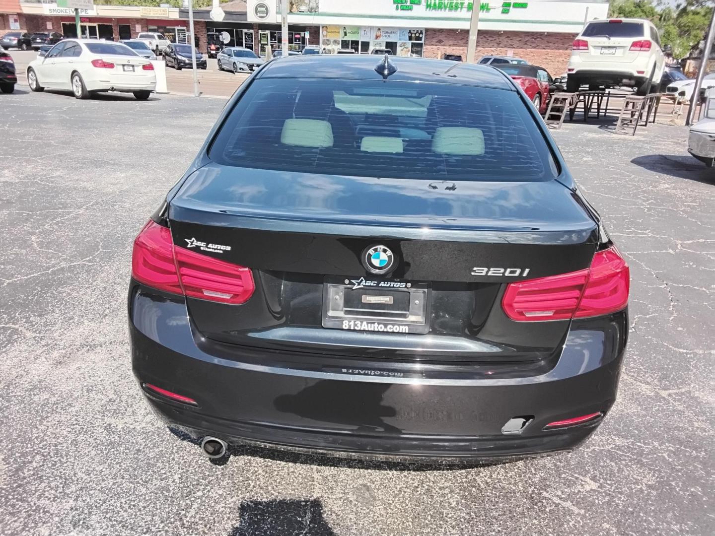 2018 BLACK /Beige BMW 3-Series 320i Sedan (WBA8A9C58JA) with an 2.0L L4 DOHC 16V engine, 8A transmission, located at 6112 N Florida Avenue, Tampa, FL, 33604, (888) 521-5131, 27.954929, -82.459534 - $499 DOWN PLUS TAX & TAG. - Photo#11