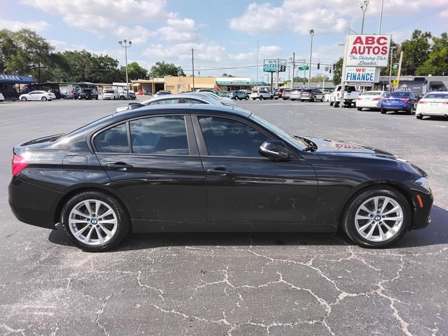 2018 BLACK /Beige BMW 3-Series 320i Sedan (WBA8A9C58JA) with an 2.0L L4 DOHC 16V engine, 8A transmission, located at 6112 N Florida Avenue, Tampa, FL, 33604, (888) 521-5131, 27.954929, -82.459534 - $499 DOWN PLUS TAX & TAG. - Photo#3
