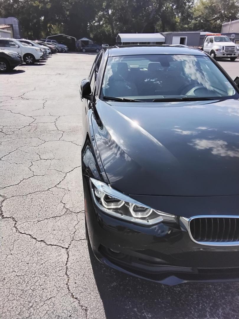 2018 BLACK /Beige BMW 3-Series 320i Sedan (WBA8A9C58JA) with an 2.0L L4 DOHC 16V engine, 8A transmission, located at 6112 N Florida Avenue, Tampa, FL, 33604, (888) 521-5131, 27.954929, -82.459534 - $499 DOWN PLUS TAX & TAG.- Photo#6