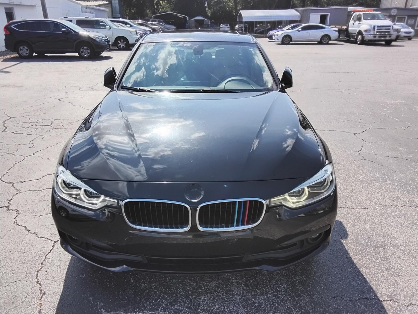 2018 BLACK /Beige BMW 3-Series 320i Sedan (WBA8A9C58JA) with an 2.0L L4 DOHC 16V engine, 8A transmission, located at 6112 N Florida Avenue, Tampa, FL, 33604, (888) 521-5131, 27.954929, -82.459534 - $499 DOWN PLUS TAX & TAG.- Photo#5