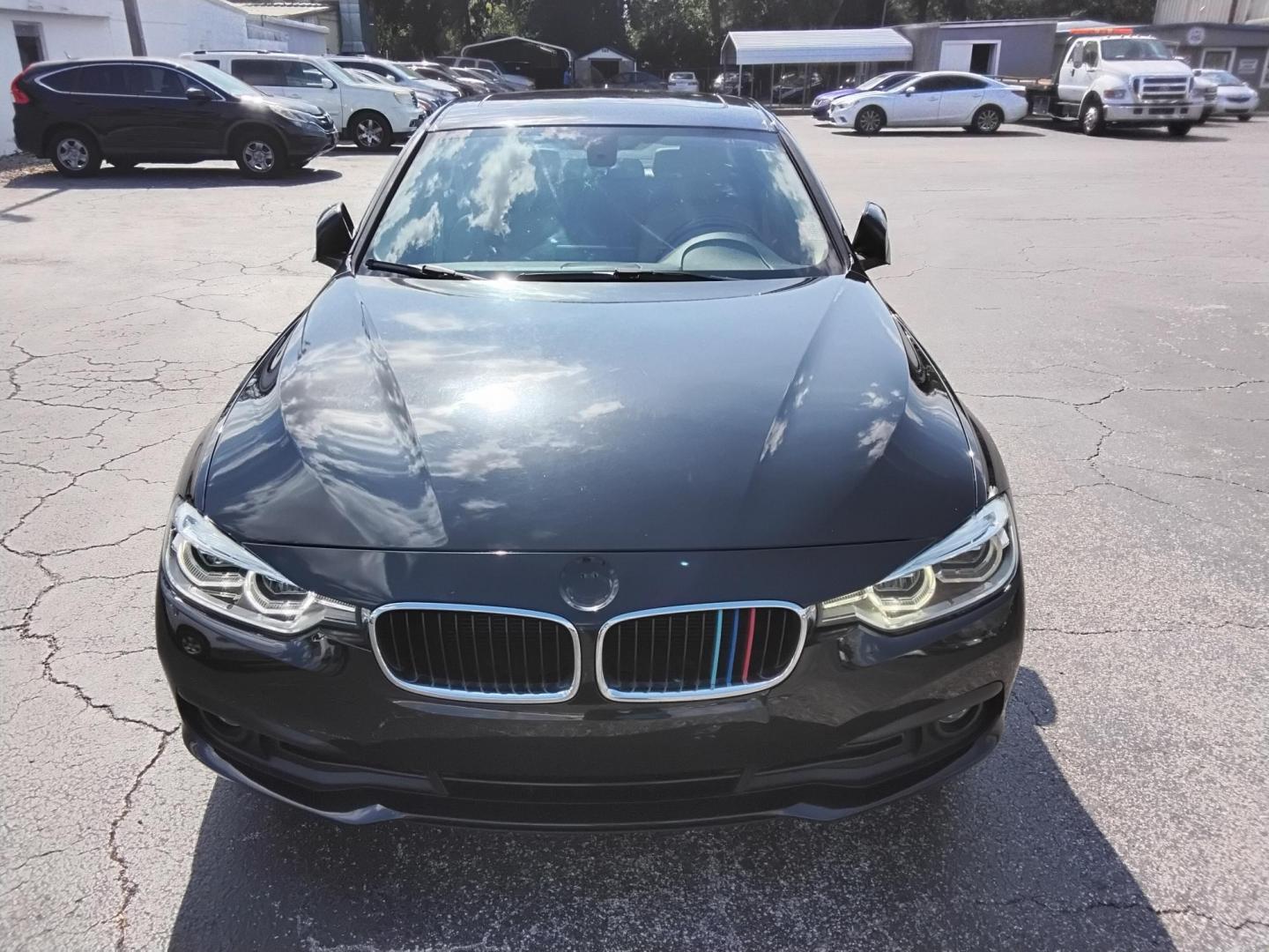 2018 BLACK /Beige BMW 3-Series 320i Sedan (WBA8A9C58JA) with an 2.0L L4 DOHC 16V engine, 8A transmission, located at 6112 N Florida Avenue, Tampa, FL, 33604, (888) 521-5131, 27.954929, -82.459534 - $499 DOWN PLUS TAX & TAG. - Photo#5