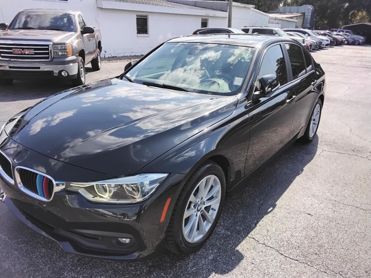 2018 BLACK /Beige BMW 3-Series 320i Sedan (WBA8A9C58JA) with an 2.0L L4 DOHC 16V engine, 8A transmission, located at 6112 N Florida Avenue, Tampa, FL, 33604, (888) 521-5131, 27.954929, -82.459534 - $499 DOWN PLUS TAX & TAG.- Photo#2