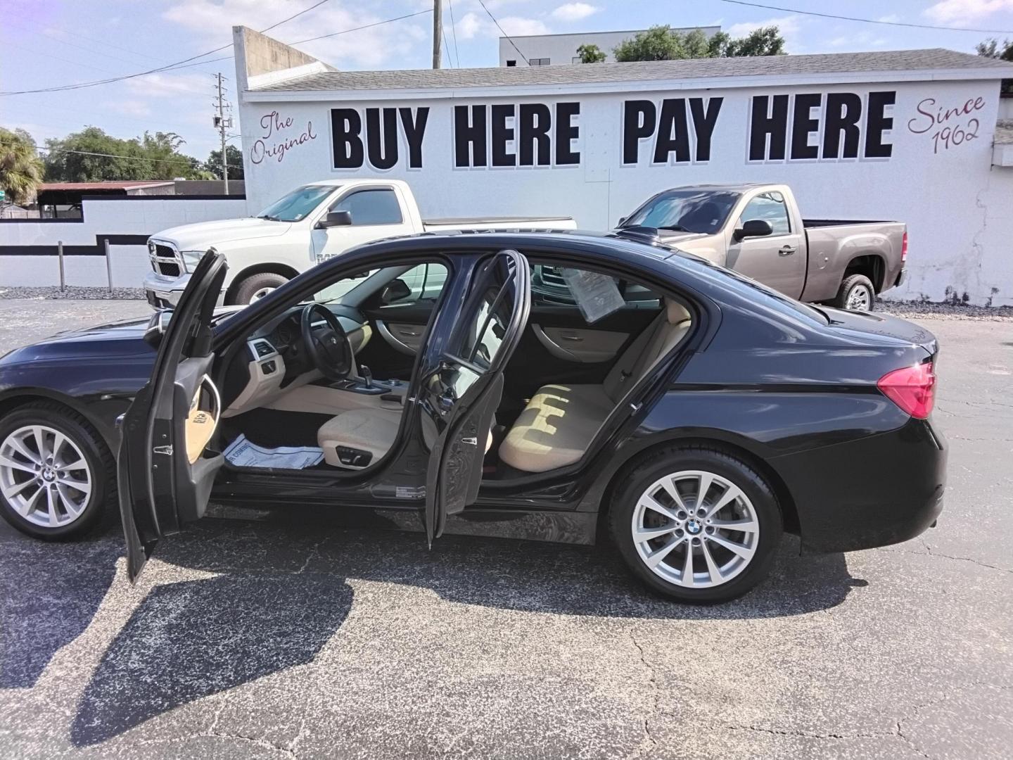 2018 BLACK /Beige BMW 3-Series 320i Sedan (WBA8A9C58JA) with an 2.0L L4 DOHC 16V engine, 8A transmission, located at 6112 N Florida Avenue, Tampa, FL, 33604, (888) 521-5131, 27.954929, -82.459534 - $499 DOWN PLUS TAX & TAG.- Photo#1