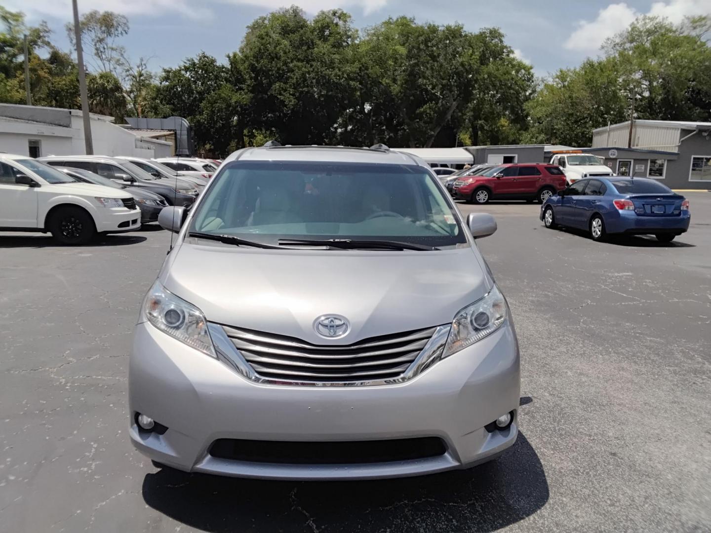 2014 SILVER /Beige Toyota Sienna XLE FWD 8-Passenger V6 (5TDYK3DC8ES) with an 3.5L V6 EFI DOHC 24V engine, 5-Speed Automatic transmission, located at 6112 N Florida Avenue, Tampa, FL, 33604, (888) 521-5131, 27.954929, -82.459534 - $499 DOWN PLUS TAX & TAG. - Photo#1