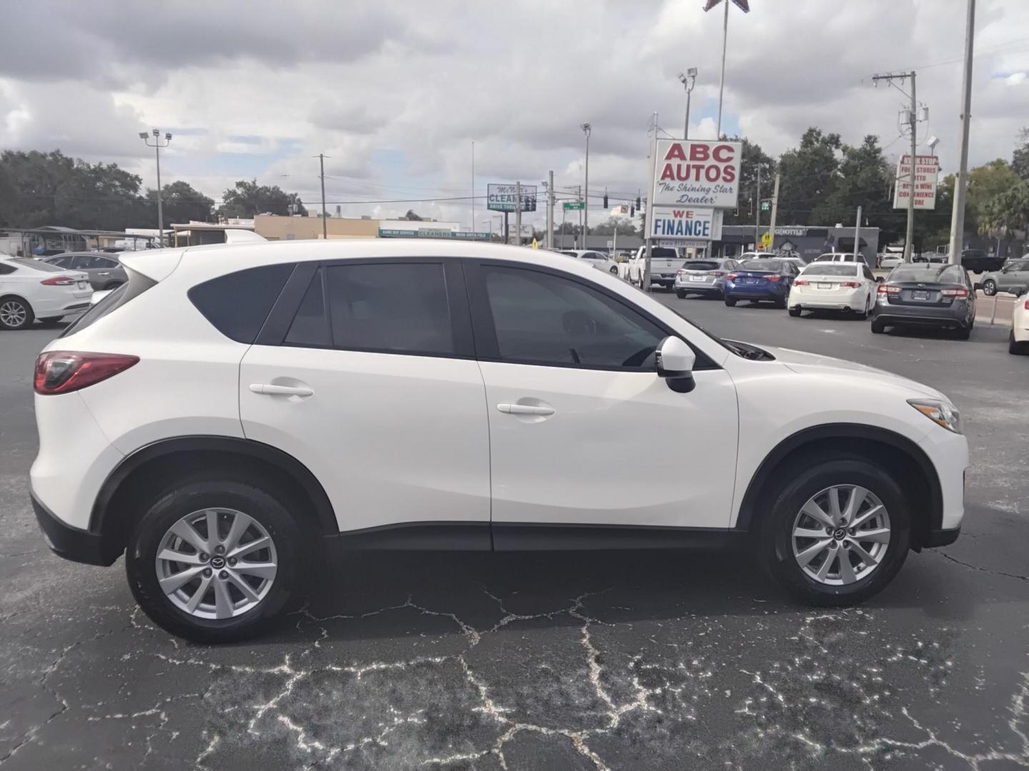 2014 White /Black Mazda CX-5 Sport AT (JM3KE2BE0E0) with an 2.5L L4 DOHC 16V engine, 6-Speed Automatic transmission, located at 6112 N Florida Avenue, Tampa, FL, 33604, (888) 521-5131, 27.954929, -82.459534 - $499 down plus tax & tag. - Photo#2